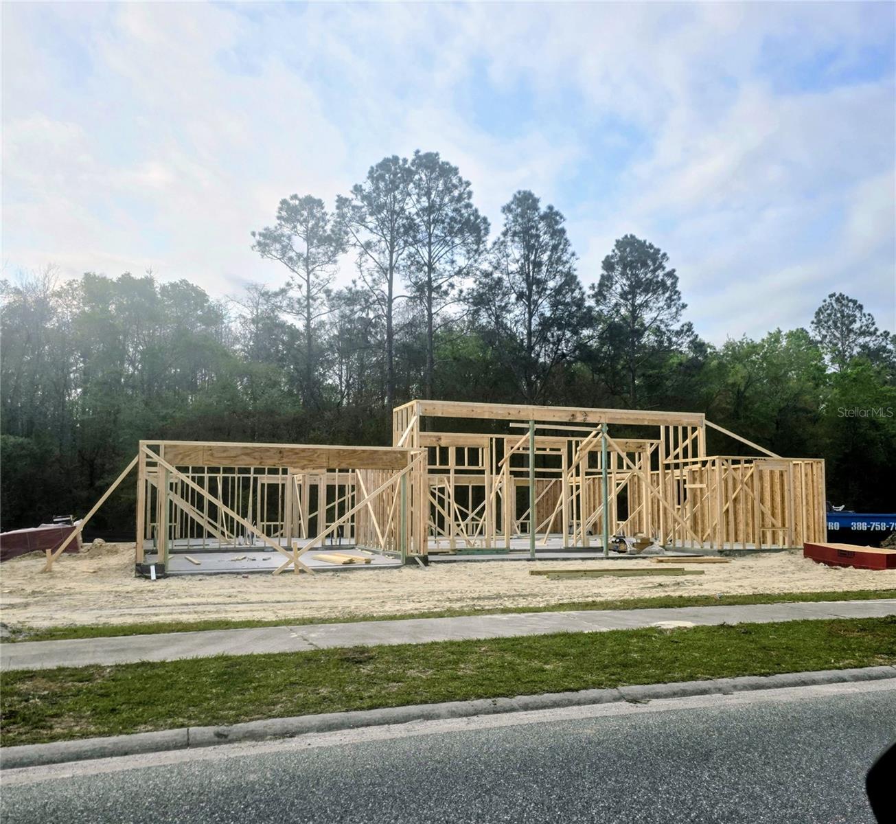 Under Construction. Under Construction. Beautiful frontage on the pond! Pre-construction with vaulted and elevated ceilings plus ample windows along the rear and front main living areas. This beautiful 4 bedroom, 2 bath, 2 car garage home sits on a peaceful homesite. In addition to a formal living and dining room, the kitchen with 36" upper custom wood cabinets with crown molding, granite kitchen counter tops, energy efficient appliances and separate pantry. The home boasts a breakfast bar and a separate breakfast nook. There is a spacious primary suite has a private entry from the covered patio and the ensuite 5 ft tiled wall to wall walk in shower, two walk in closets and a double sink vanity! Enjoy outdoor entertaining in this peaceful community on the home's large rear covered 8x27 lanai!