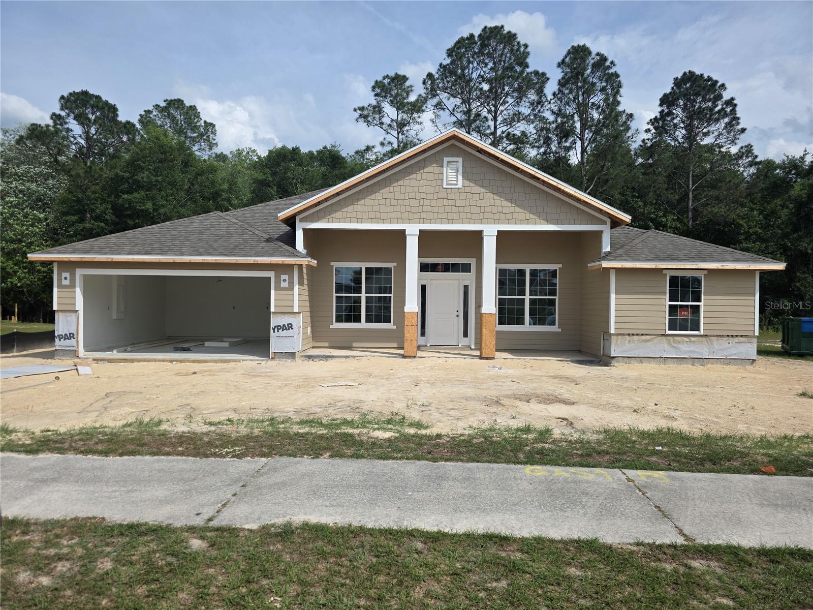 Under Construction. Under Construction. Beautiful frontage on the pond! Pre-construction with vaulted and elevated ceilings plus ample windows along the rear and front main living areas. This beautiful 4 bedroom, 2 bath, 2 car garage home sits on a peaceful homesite. In addition to a formal living and dining room, the kitchen with 36" upper custom wood cabinets with crown molding, granite kitchen counter tops, energy efficient appliances and separate pantry. The home boasts a breakfast bar and a separate breakfast nook. There is a spacious primary suite has a private entry from the covered patio and the ensuite 5 ft tiled wall to wall walk in shower, two walk in closets and a double sink vanity! Enjoy outdoor entertaining in this peaceful community on the home's large rear covered 8x27 lanai!
