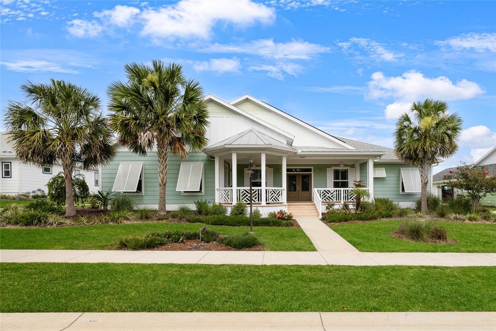Designed for the way families live today, this exceptional Green Key Village residence combines flexible multi-generational living, energy-efficient construction, and a private backyard setting in one of Central Florida's most unique gated communities. Offering nearly 3,000 square feet of thoughtfully designed living space, the home features formal living and dining rooms, an open-concept family room, and a beautifully appointed kitchen with granite countertops, upgraded cabinetry, built-in appliances, breakfast bar seating, and a spacious pantry overlooking the breakfast nook and main living areas. Architectural details including crown molding, tray ceilings, plantation shutters, and soaring ceilings add warmth and character throughout. The owner's retreat serves as a private sanctuary with direct access to the screened lanai, dual vanities, a spacious walk-through shower, and separate his-and-her walk-in closets. A standout feature rarely found in today's market is the private in-law suite complete with its own exterior entrance, kitchenette, and accessible bathroom featuring comfort-height counters and an oversized low-entry shower, creating the ideal space for extended family, guests, or a caregiver. Outside, the expansive screened lanai overlooks dedicated green space that provides added privacy with no future rear neighbors behind portions of the property. Additional upgrades include a whole-home water treatment system and an owned solar array that helps virtually eliminate monthly electric costs. Life in Green Key Village offers the perfect alternative to The Villages lifestyle, providing convenient access to shopping, dining, golf, entertainment, and medical facilities without age restrictions. Residents enjoy resort-style amenities including a gated entrance, community pool, pickleball courts, basketball court, community garden, golf-cart-friendly streets, sidewalks, and a vibrant neighborhood atmosphere. If you're searching for a home that offers space for family, room to entertain, and features designed for long-term comfort and independence, then look no further because you're home.