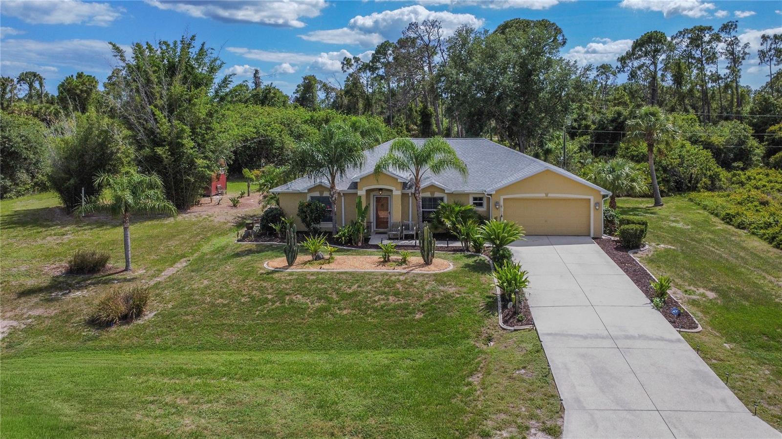 Welcome to your next pool home getaway in the heart of North Port, Florida! This well-maintained 3-bedroom, 2-bath home sits on a rare double lot, on a canal, with public water, a 2-car garage, and a spacious layout with formal living, dining, and family rooms. Inside you’ll find vaulted ceilings and hardwood/bamboo strand flooring in the main living areas. The kitchen features Corian countertops, glass tile backsplash, stainless steel appliances, soft close cabinets, a breakfast bar, and dinette area with built-in pantry shelving. The primary suite fitted with crown molding, dual closets, and an en-suite bath with walk-in shower and separate soaking tub. The split floor plan provides privacy for the additional bedrooms. Step outside to a screened-in lanai with a saltwater pool and hot tub, perfect for entertaining and relaxing year-round. The canal-side double lot offers extra space, privacy, and easy access for fishing and outdoor enjoyment. A 10x20 shed with loft, electricity, and AC adds valuable storage and workspace. Major upgrades include a 2023 roof, 2023 pool enclosure screens, 2025 Rheem AC with dual UV kits, custom hurricane shutters, Charger Pro water softener, and reverse osmosis drinking water system, Nest thermostat, septic recently pumped and inspected, and freshly manicured landscaping throughout the property! Conveniently located near I-75, shopping, dining, North Port Aquatic Center, and Charlotte Sports Park, this home offers the perfect mix of space, upgrades, and Florida lifestyle.