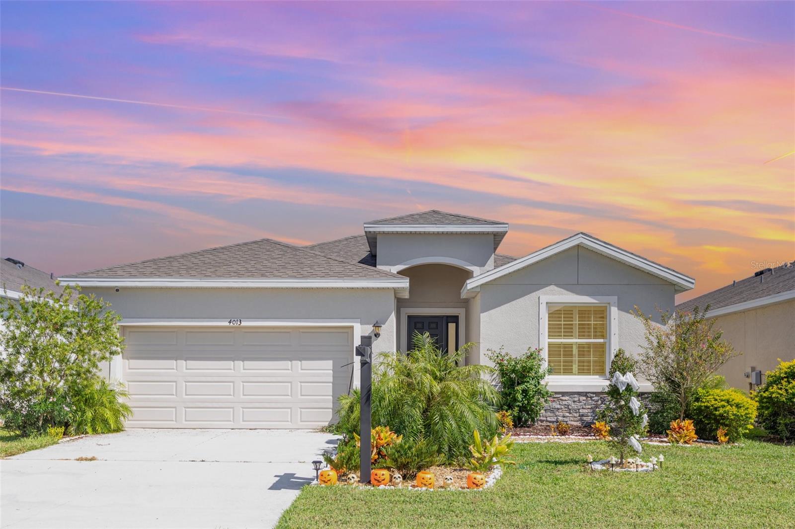 Don't wait to build! MOVE-IN READY! ***This meticulously maintained home, boasting 4 bedrooms and 2.5 baths on a captivating conservation lot, provides a serene backdrop for everyday living. The highly desired open floor plan (Lantana) bathes the living spaces in natural light as you enter, creating a warm and welcoming atmosphere. The gourmet kitchen offers sleek countertops, stainless steel appliances, and a generous pantry, seamlessly flowing into the spacious living area—an ideal space for entertaining and everyday family life. Plantation shutters in all bedrooms added. Upgraded refrigerator, washer and dryer included a $10,000.00 value. The owner's suite offers a generous layout, with his and hers walk-in closets and a spa-like ensuite bathroom with a soaking tub and a separate walk-in shower. Three additional bedrooms provide comfortable accommodations for family members or guests, while the extra half bath adds convenience to your daily routine. Step outside to the covered lanai and discover your private oasis. The beautifully landscaped backyard, set against a conservation backdrop, invites you to relax, unwind, and savor the tranquility of your surroundings. Perfect for outdoor gatherings or a quiet retreat after a long day. It is just a few steps from the community pool. Situated in a sought-after neighborhood, this home is a tranquil retreat close to local amenities, shopping centers, and hospitals. With easy access to major highways, the pristine beaches of the Gulf Coast and the vibrant cultural scene of downtown Bradenton are just a short drive away. Don't miss this opportunity! Contact us to schedule a showing. Make 4013 Lively Coral Pl your home, where the perfect blend of comfort, elegance, and natural beauty awaits. Schedule a showing today and experience the lifestyle that this Bradenton gem has to offer.