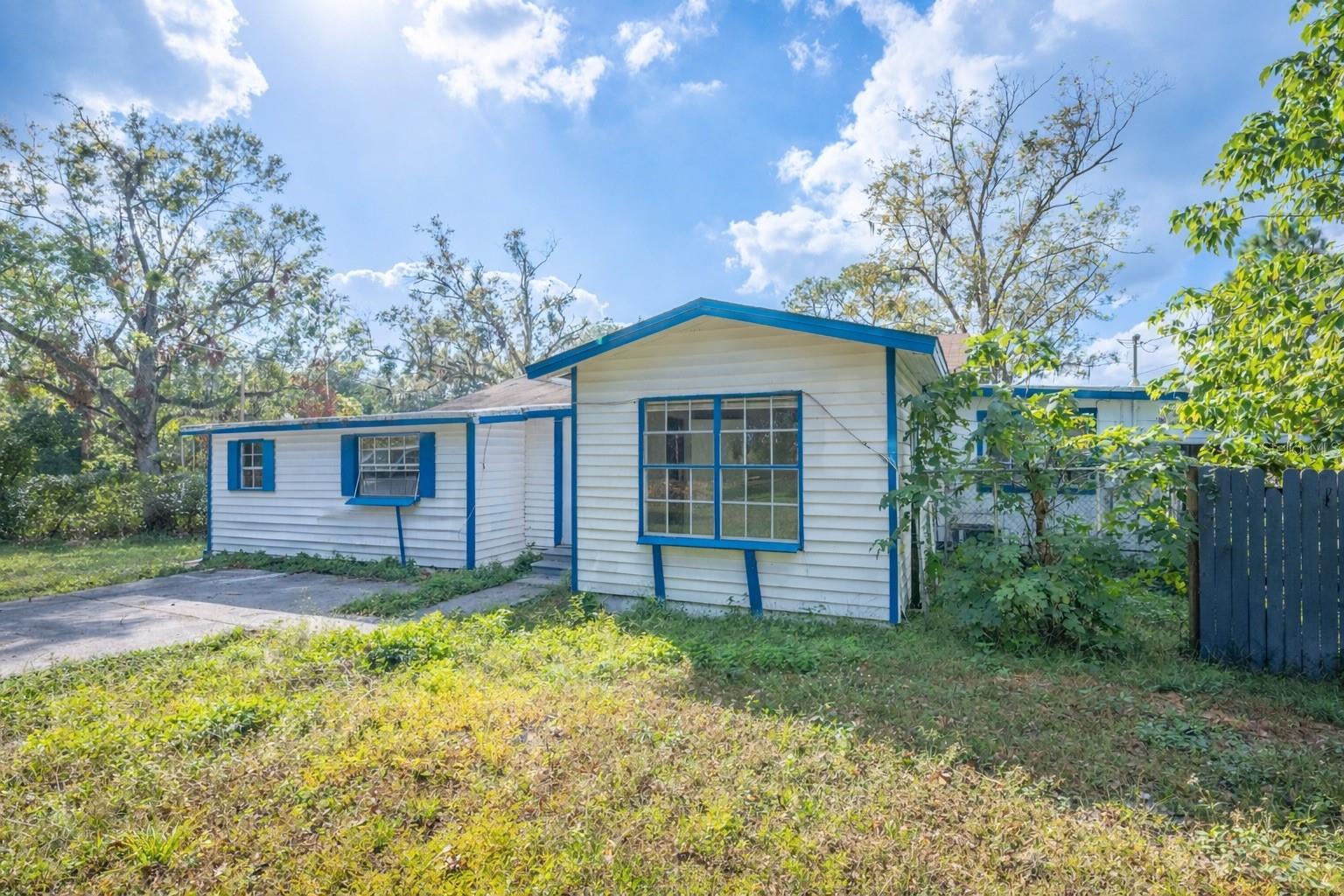 One or more photo(s) has been virtually staged. Amazing investment opportunity on an oversized 0.57-acre lot featuring two homes on one property, both currently tenant occupied and offering immediate income potential. The main home offers 3 bedrooms, 2 bathrooms plus a large bonus room that can easily serve as a fourth bedroom, dining space, home office, or additional living area. The home features hard flooring and tile, providing easy maintenance and durability. The spacious layout allows for plenty of natural light, while the large yard offers ample space for outdoor enjoyment.

Located behind the main home is a separate 2-bedroom, 1-bath guest cottage with its own kitchen and separate driveway access, offering privacy for both residences. This additional unit adds excellent flexibility for long-term rental income or multi-generational living options.

Situated just minutes from I-4 and Highway 92, this property offers convenient access to downtown Lakeland, shopping, dining, and major Central Florida destinations. Whether you're looking to expand your investment portfolio or secure a property with multiple income streams, this versatile property presents a rare opportunity.