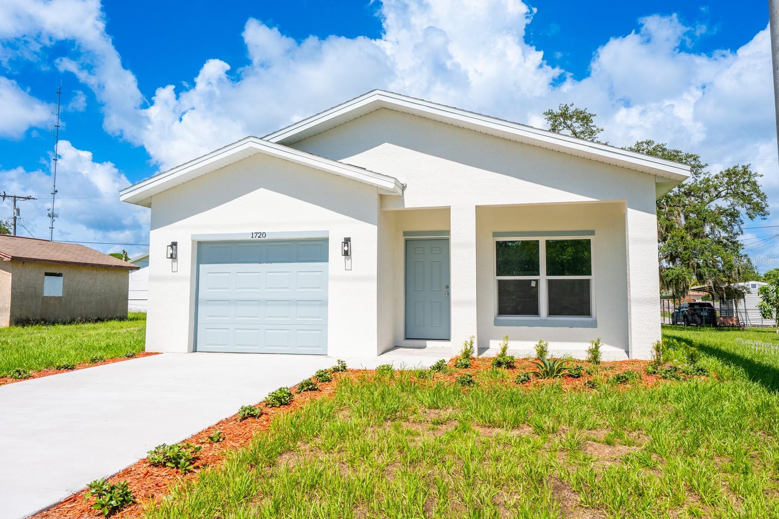 LIKE NEW HOME ~ COMPLETED 2025! Welcome to S Deleon Ave, nestled in the growing Lincoln Park community of Titusville – just minutes from the Indian River, with NO HOA and convenient access to local shopping, dining, Sand Point Park, and more! This light-filled home features sleek gray-toned CERAMIC TILE FLOORS throughout, blending durability with modern style. A fresh, neutral color palette enhances the bright, OPEN CONCEPT layout, creating a clean canvas for your personal touch. The heart of the home is the kitchen, offering STAINLESS STEEL APPLIANCES, shaker-style cabinetry, solid surface countertops, a center ISLAND with breakfast bar seating, and a WALK-IN PANTRY – perfect for both daily living with family and entertaining friends. A desirable SPLIT BEDROOM FLOOR PLAN ensures privacy, with the spacious PRIMARY SUITE delivering a large WALK-IN CLOSET and a luxurious en-suite bath featuring an extended dual-sink vanity and a custom-tiled WALK-IN SHOWER. Two additional bedrooms share a second full bath with matching modern finishes. Located in an established area experiencing new growth, this home is surrounded by a blend of charming older homes and new construction. Whether you are a first-time buyer or seeking a strong INVESTMENT OPPORTUNITY, 1720 S Deleon Ave offers incredible value, style, and convenience. Call today to schedule a tour! **Seller may consider buyer concessions if made in an offer**