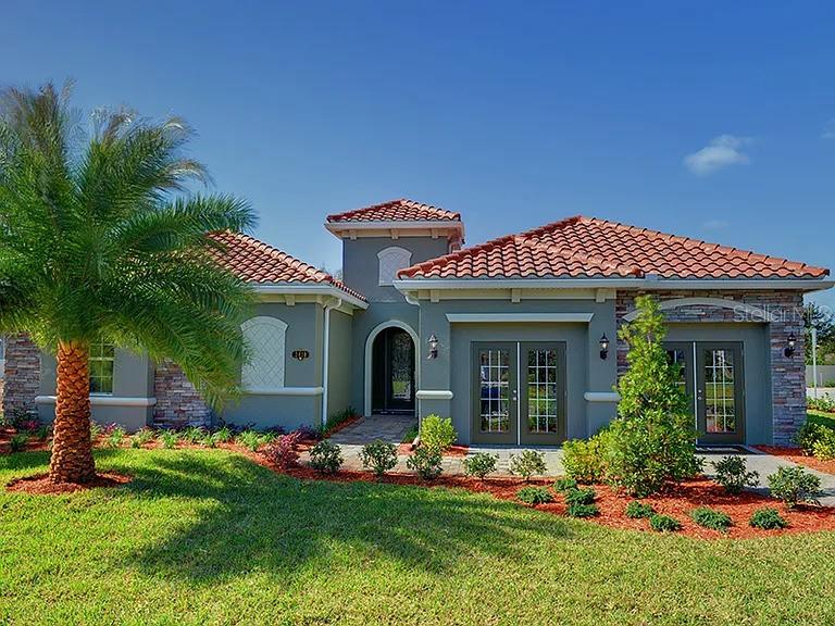 Welcome to this exceptional former builder model home in the desirable Avilla community. This beautifully maintained 4-bedroom, 3-bath residence offers 3,410 heated square feet of thoughtfully designed living space on a spacious 0.21-acre homesite.

The open floor plan features a gourmet kitchen with granite countertops, stainless steel appliances, custom cabinetry, and a large center island. The luxurious primary suite includes a spa-like bath and an oversized custom walk-in closet.

Enjoy Florida living at its finest with a private screened pool, expansive pool deck, and fully equipped outdoor summer kitchen, perfect for entertaining. Originally purchased as the builder's final model home, the property showcases premium upgrades and exceptional craftsmanship throughout.

Seller intends to convey the property substantially furnished, excluding personal belongings and décor. Conveniently located near shopping, dining, major highways, and Orlando's world-famous attractions.

Schedule your private showing today!