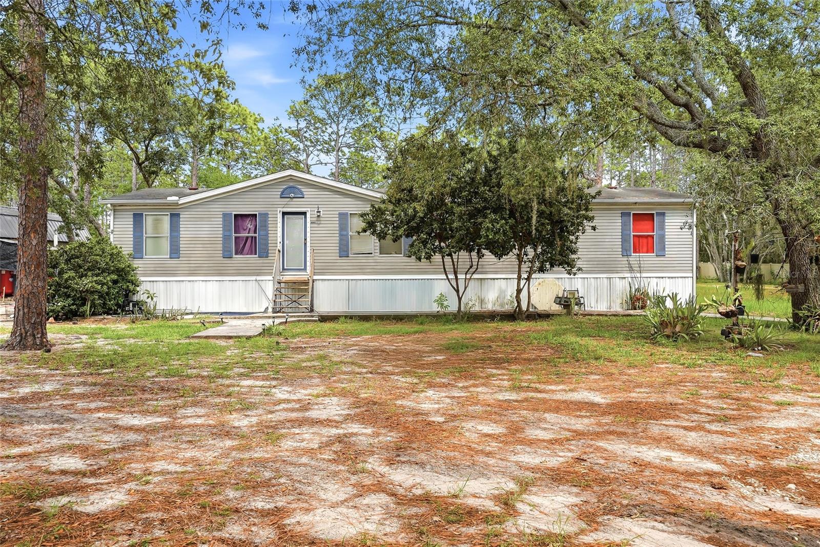 Bring your homestead vision to life on this gated and fenced 1.16-acre AR-zoned property offering privacy, space, and a country style living with no HOA! Situated on a paved road, No Flood Zone this 1997 double-wide manufactured home features 3 bedrooms, 2 bathrooms, a split-bedroom layout, and a spacious primary suite with en-suite bath and large walk-in closet. Interior features include wood plank-style flooring, an inside utility/laundry utility space, kitchen with dining space, and plenty of opportunity to personalize and make it your own.

Outside, enjoy room for animals, gardening, and other fun recreational use. A workshop/shed (2023) with electricity conveys as-is, along with private well and septic systems already in place. HVAC replaced in 2023.

Ideal opportunity for buyers seeking a light fixer-upper, investment potential, or a place to create their own homestead lifestyle on over an acre of land.

Property is being marketed site unseen only at this time. Interior access will be granted during the inspection period following an accepted contract. Please do not disturb occupants or access the property without authorization.
