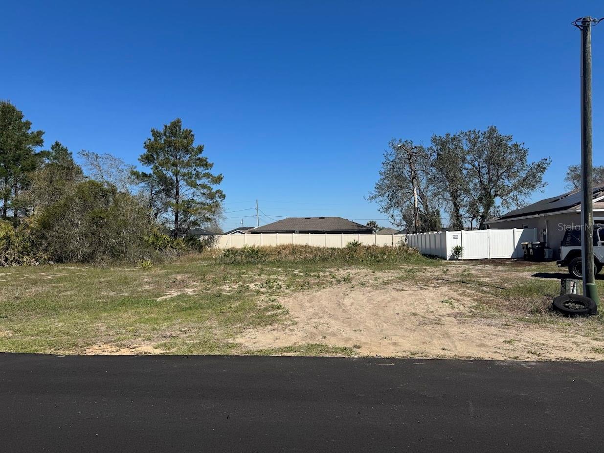 Rare opportunity to own a cleared, survey-ready lot in the heart of Poinciana — build your dream home with no delays! This 8,076 sq ft lot (0.19 acres) sits in the established Poinciana Neighborhood 2, Village 8, and is located in Flood Zone X — meaning no flood insurance required. The lot is already cleared, the survey is complete, and public water is available. Just bring your builder and your plans.
Located in one of Central Florida's fastest-growing communities spanning Polk and Osceola counties, Poinciana offers incredible value with direct access to Poinciana Parkway, providing a quick commute to Kissimmee, US-192, and the broader Orlando metro. The SunRail Poinciana Station puts rail transit right at your doorstep — a major infrastructure win for commuters and future value appreciation. The Florida Turnpike and US-17/92 are easily accessible, making this location a true Central Florida hub.
Within minutes you'll find the Walt Disney Wilderness Preserve, world-class shopping, dining, and entertainment, and iconic destinations including Walt Disney World, Universal Studios, and LEGOLAND Florida. The community is loaded with amenities through the Association of Poinciana Villages — including pools, fitness centers, the Mary Jane Arrington Gym & Aquatic Center, sports courts, and parks — all for just $300/year HOA.
Whether you're a builder, investor, or future homeowner, this lot checks every box. Lot dimensions: 114x72x114x76. Low annual taxes. Priced to sell. Don't miss this one!