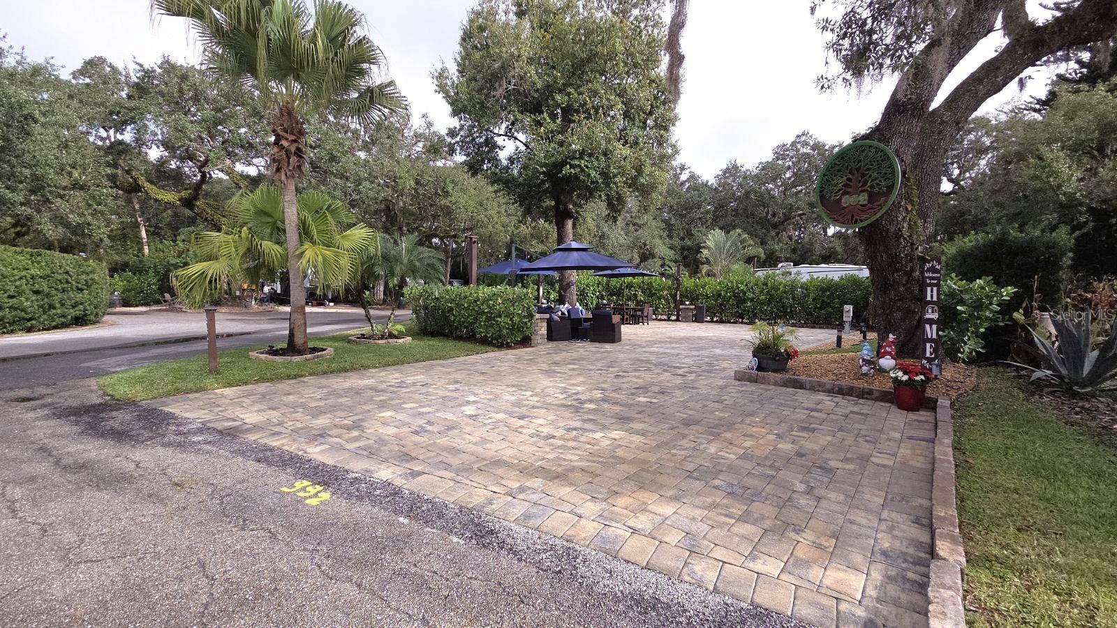Buy a LUXURY RV Lot in Central FLORIDA!  Full Privacy at this River Ranch Lot in Central Florida! This Deeded RV Lot is located in Phase 3 and sits on a large corner lot that has been completely renovated!   This spacious property offers a NEW extended Paver pad, several seating and dining areas, a cozy firepit area, a full size shed and new landscape and irrigation.  Cafe lights adorn the entire Lot and highlight the gorgeous Oak Tree with a custom shaded bench seating!   All furniture stays with the Lot with an acceptable contract terms.  This is truly a turn-key property.  This Lot is steps to pool, laundry, bathhouse and pickle ball!  This property is a Fan-Favorite for a Rental.  Sellers will pass all rentals to new owner.  Looking for entertainment and fun? River Ranch offers it here!! For starters, there is a LIVE Rodeo every Saturday night – an excellent display of showmanship and fun for the entire family! There is even a Saloon (family friendly), with LIVE bands, DJs, dance parties and they give line dancing lessons for free. There is a waterpark, an adventure park which has a bounce house, mechanical bull, climbing tower, Arcade, mini golf, outside movie on the greens, bicycle rentals, airboat rides, river boat rides, swamp buggy, hayrides, petting farm, trap & skeet range and a bow target for shooting. There are several places to eat on property. The River Ranch Chop House serves delicious food and drinks, a waterfront Smokehouse Grill serving delicious BBQ, a pizza shop and an ice cream and coffee shop (serving Starbucks.) There is also a General store and a Western store to grab all of your favorite Cowboy/Cowgirl finds! Watch the Bison, Steers, Horses and other wildlife! Don’t forget to check out the Petting Farm!!