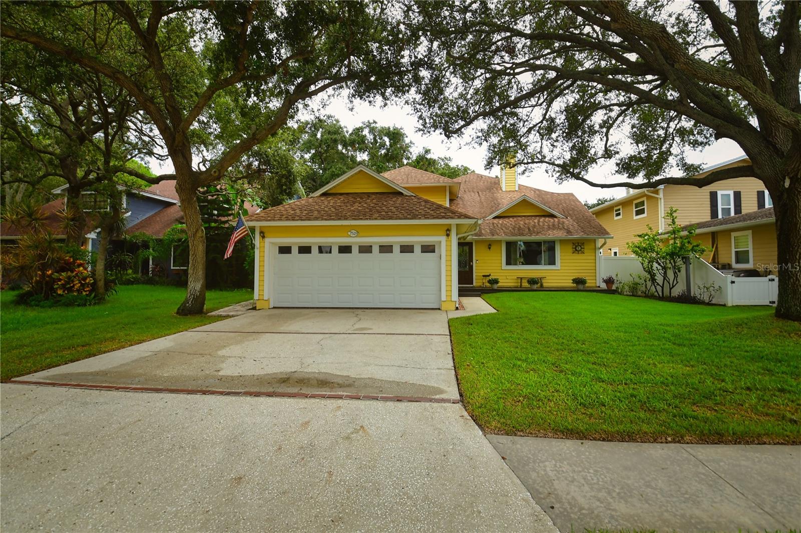 If space and location is what you are looking for, this home delivers! This beautiful 5-bedroom, three-bathroom home is ready for its new owners.  Featuring TWO primary suites, it offers the perfect set-up for a teenager, guests or even a mother-in-law suite.  As soon as you step inside, you are welcomed by a stunning brick fireplace and a cozy family room that creates the perfect atmosphere for relaxing or entertaining. 
The spacious kitchen features abundant wood cabinetry offering ample storage, along with extra room for a large dining table.  Just off the kitchen is an additional living/entertaining space overlooking the well maintained screened-on pool.  There is another smaller room of the back of the home, ideal for a home office or craft room.  Upstairs you will find the two primary suites with tastefully updated bathrooms, along with a cozy loft nook perfect for curling up with your favorite book.
Located just minutes from our beautiful Gulf beaches and fantastic restaurants, THIS is where your Florida living begins!