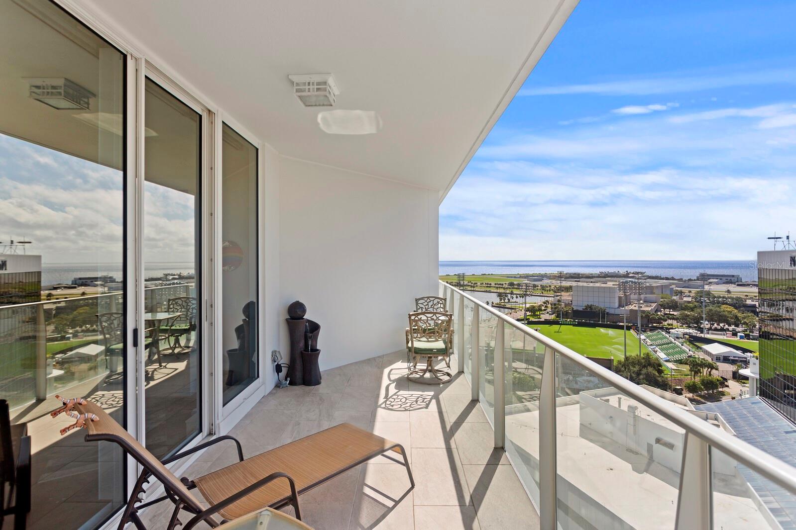 EXCEPTIONAL VALUE, STUNNING WATER VIEWS, AND THE ULTIMATE DOWNTOWN LIFESTYLE!
Experience luxury urban living at an exceptional price in this beautifully upgraded 16th-floor residence at Signature Place, one of downtown St. Petersburg’s most iconic contemporary towers.
This spacious one-bedroom, one-and-a-half-bath condominium also features a versatile den—perfect for a home office, fitness space, or potential guest area. Inside, you'll find thoughtfully selected upgrades throughout, including engineered maple hardwood flooring by BAST Flooring (Hillshire Maple Autumn Collection, 2023), fresh interior paint (2023), and a custom barn door enclosing the laundry area while accommodating a full-size washer and dryer.
The kitchen impresses with granite countertops, sleek European-style cabinetry, and a custom tile backsplash, creating a modern and sophisticated space for everyday living and entertaining.
Enjoy not one, but two private balconies—one off the living room and another off the primary bedroom—both beautifully tiled (2020) and offering sweeping views of the sparkling waters of Tampa Bay, the downtown skyline, and Albert Whitted Airport. Whether you're enjoying your morning coffee on the balcony or relaxing on the couch in the living room, you'll appreciate the beautiful water views and watch private aircraft take off and land in the distance.
Additional upgrades include a new water heater (2020), new HVAC system (September 2025), upgraded bathroom with custom decorative tile accents, Nest thermostat, three ceiling fans, electric blinds in the living room, and a secured parking space featuring a dedicated electrical conduit installed in 2024 (a $2,200 value) for future EV charging.
Residents of Signature Place enjoy an unmatched resort-style lifestyle with a 24-hour concierge, heated infinity-edge pool and spa, state-of-the-art fitness center, club and media rooms, brand-new outdoor kitchen, and secured parking.
Located in the heart of downtown St. Petersburg, you'll be just steps from award-winning restaurants, waterfront parks, museums, galleries, boutique shopping, the Saturday Morning Market, and countless year-round events.
DON'T MISS THIS RARE OPPORTUNITY TO OWN IN ONE OF DOWNTOWN ST. PETE'S MOST SOUGHT-AFTER LUXURY TOWERS—AT A PRICE THAT'S HARD TO FIND IN TODAY'S HIGH-RISE MARKET.
