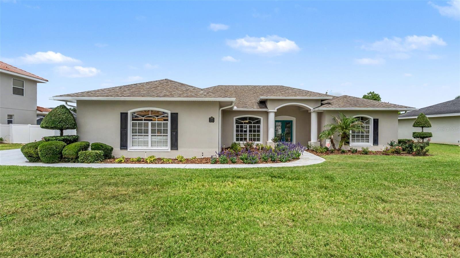 Nestled within Highlands Vista, an exclusive gated enclave of just 48 custom homes in one of South Lakeland's most desirable locations, this impeccably maintained 4-bedroom, 3-bathroom pool home offers the perfect combination of elegance, comfort, and modern convenience. Thoughtfully updated and meticulously cared for, this exceptional residence is ready to welcome its next owner.
Step through the double doors into a versatile flex space that can serve as a home office, sitting room, playroom, or additional living area, along with a separate formal dining room perfect for entertaining. The gourmet kitchen features granite countertops, a dramatic waterfall island, stainless steel appliances, a farmhouse marble sink, glass tile backsplash, custom cabinetry, skylight, and a custom-built walk-in pantry. The kitchen flows seamlessly into the family room and casual dining area, with French doors leading to the covered lanai and pool area.
Natural light fills the home, highlighting the high ceilings, tray ceilings, crown molding, recessed lighting, and architectural details throughout. The split-bedroom floor plan provides privacy for the spacious primary suite, which features French door access to the lanai and pool, dual walk-in closets, beautiful bamboo flooring installed in 2021, and a luxurious en-suite bath with dual granite vanities, a jetted garden tub, walk-in shower with seating, and private water closet.
On the opposite side of the home, three additional bedrooms feature wood flooring and are served by two full bathrooms. One bedroom functions as a private guest suite with its own bathroom, dual vanities, walk-in shower, and separate water closet making it ideal for multi-generational living or extended guests. A dedicated office provides additional flexibility for working from home.
Outdoor living is equally impressive with a screened lanai, convenient kitchen pass-through serving counter, sparkling pool with child safety gate, repainted pool deck, fully fenced backyard, and a playset that conveys with the home. Whether relaxing poolside or entertaining guests, this backyard is ready to enjoy.
Additional upgrades include a remodeled third bathroom, remodeled laundry room, new luxury vinyl plank flooring in the living room (2026), new attic insulation installed in 2024 with a lifetime insulation guarantee, two A/C units, solar attic ventilator, Wi-Fi-enabled irrigation system with rain sensor, a Wi-Fi-capable 3-car garage, a 240V outlet for EV charging, a 50-amp garage subpanel. The washer, dryer (2025), refrigerator (2024), garage freezer, and playset are all included.
The roof was replaced in 2019, providing peace of mind for years to come. Conveniently located near the Polk Parkway, shopping, dining, medical facilities, and top-rated schools, this exceptional home offers the perfect blend of luxury, efficiency, and Florida lifestyle living.
Virtual tour available. Buyer to verify all measurements and information deemed important