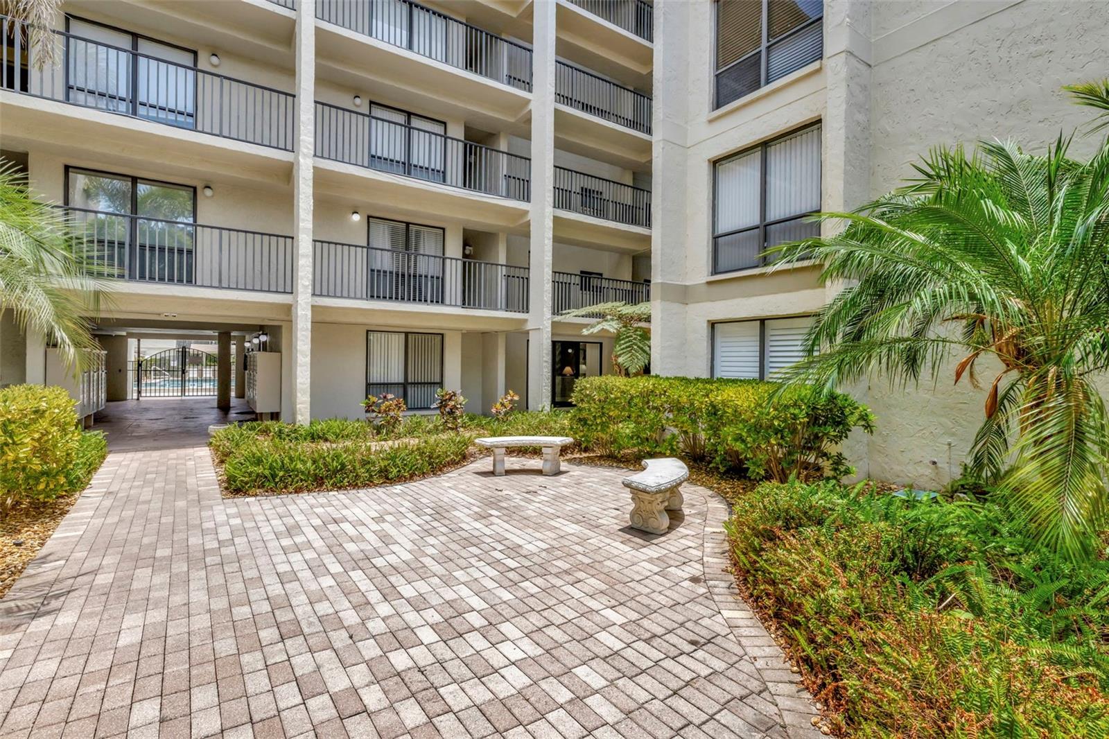 Elevated Living on the 4th Floor!  Discover this well appointed 1-bedroom, 1-bath condo just minutes from the world-renowned Siesta Key Beach. This TURN KEY residence offers the ideal blend of relaxed Florida living and exceptional value.  Step into a bright and airy space where natural light pours into the east-facing screened balcony, overlooking lush tropical landscaping. The interior features ceramic tile flooring throughout the kitchen, dining, and living areas, creating a clean and cohesive look.  The kitchen is equipped with stainless steel appliances, including a range and dishwasher, and boasts a generous walk-in pantry for all your storage needs. A separate large closet provides ample space for beach and pool gear.  Residents and guests enjoy access to a host of amenities including a community pool, tennis courts, social room, and fishing pier. Recent updates include a brand-new water heater and a newer A/C system for added peace of mind.
Best of all, this gem allows for weekly rentals, offering a fantastic opportunity to offset ownership costs. Gross rental income ranging from $30,000 to $40,000 annually.  Great place to vacation when you can...and rent when you can't!   The unit includes one assigned covered parking space, plus plenty of guest parking.  Don’t miss out—schedule your showing today!