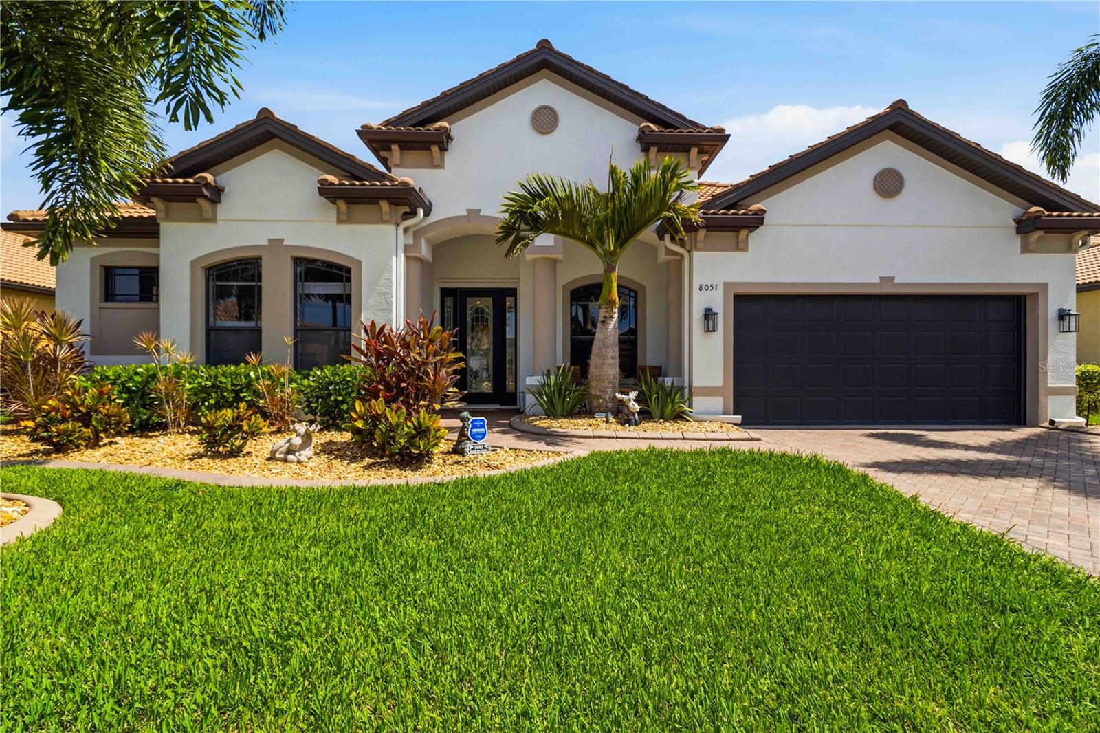 Virtually Staged. THIS IS THE ONE YOU’VE BEEN WAITING FOR! Completely remodeled, loaded with upgrades, and designed for the ultimate Florida lifestyle, this stunning 4-bedroom, 3-bath POOL HOME offers 2,456 square feet of beautifully updated living space where every detail has been thoughtfully considered.

From the moment you step inside, the open-concept design creates an immediate sense of space and style. The living and dining areas flow seamlessly into the family room and kitchen, making this home perfect for both everyday living and entertaining. A striking marble-surround electric fireplace anchors the living space, while the custom wet bar with stone countertop adds the perfect touch for hosting family and friends. Need additional flexibility? The front bonus room can easily serve as a home office, den, gym, or even a 5th guest room.

Luxury vinyl flooring runs throughout the main living areas, complemented by engineered hardwood in the bedrooms. The kitchen features appliances replaced within the last three years, while all three bathrooms have been beautifully updated. The impressive primary suite offers a true retreat with a fully remodeled bathroom featuring a soaking tub, separate shower, updated tile, new cabinetry, and modern fixtures.

But the real showstopper is outside.

Step into your own private Florida oasis, where the resurfaced pool, new decorative waterfall added in 2026, new pavers, outdoor bar and kitchen, and multiple gathering spaces create a backyard built for unforgettable days and nights. Whether you’re relaxing by the pool, cooking outdoors, entertaining friends, or simply enjoying the Florida sunshine, this backyard delivers the lifestyle people move here to experience. A new pool heater was installed in 2020, a new pool pump in 2025, and an additional storage shed provides even more functionality.

The upgrades continue with enhanced privacy landscaping, decorative rock, custom curbing, low-maintenance front landscaping, and an epoxy-coated 2-car garage with built-in cabinetry. The entire home also offers hurricane protection, including remote-controlled motorized shutters across the rear sliders and easy-to-use accordion shutters along the sides.

Located in a rare community featuring beautiful brick-paver sidewalks throughout, this home also offers exceptionally low HOA fees of just $165 per month, including lawn cutting, edging, and irrigation—and NO CDD FEES.

Completely remodeled. Incredible outdoor living. Extensive upgrades. Low HOA. No CDD.

Homes offering this much at this price are hard to find. Schedule your private showing today and experience firsthand why this is the one you won’t want to let get away.