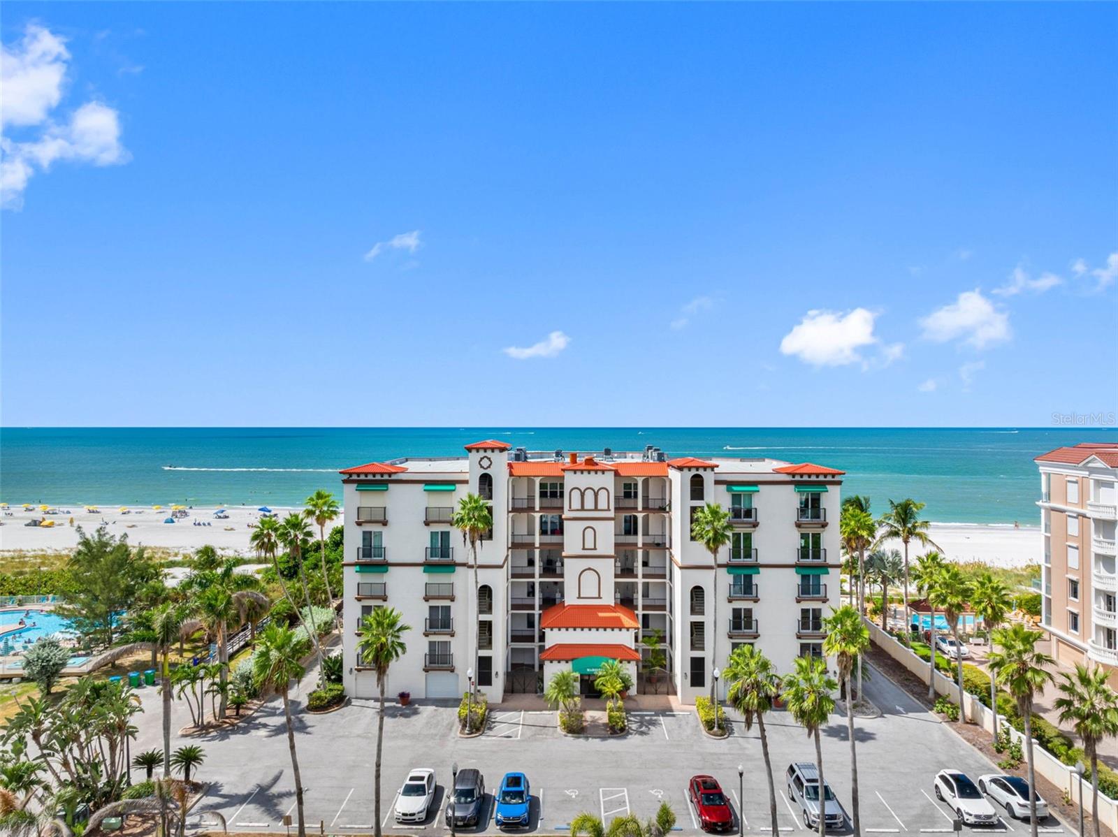 A residence on the Gulf of Mexico. The Marquesa is a Mediterranean-style enclave of seventeen homes set directly on the sand in Treasure Island. Residence 104 is among its most considered. Steps from powdery sand, shimmering turquoise water, and the kind of sunsets worth planning your evening around. Three OPULENT EN-SUITE BEDROOMS, each with its own luxurious bath and spacious walk-in closet, plus a modern half bath for guests. The OVERSIZED PRIMARY SUITE faces west to the Gulf — wake to the horizon, fall asleep to the sound of the water. Its spa bath features custom cabinetry, bespoke hardware, and a JASON MICROSILK HYDROTHERAPY TUB for indulgent relaxation beneath twin starburst chandeliers. A CHEF'S DREAM KITCHEN with custom cabinetry, stone countertops, brass pot filler, WOLF range and coffee system, double SUB-ZERO refrigeration, and built-in WINE REFRIGERATOR. Bespoke hardware throughout. No detail was spared in this $438,000 (today's value) RENOVATION, evident in the chic flooring and impeccable craftsmanship. Bathed in natural light, the open-concept living spaces flow seamlessly onto a RARE OVERSIZED TERRACE — one of only two in the building. The terrace faces west. The sun sets into it. Residents enjoy a private beachfront POOL, COVERED GARAGE, SECURED LOBBY, and a private boardwalk through the sea grape to the sand. NEW ROOF and NEW ELEVATOR. HURRICANE IMPACT GLASS and AUTOMATIC SHUTTERS throughout. Near Gulf Boulevard's dining, boutique shopping, and water adventures. Primary residence, vacation haven, or investment. Schedule your private tour.
