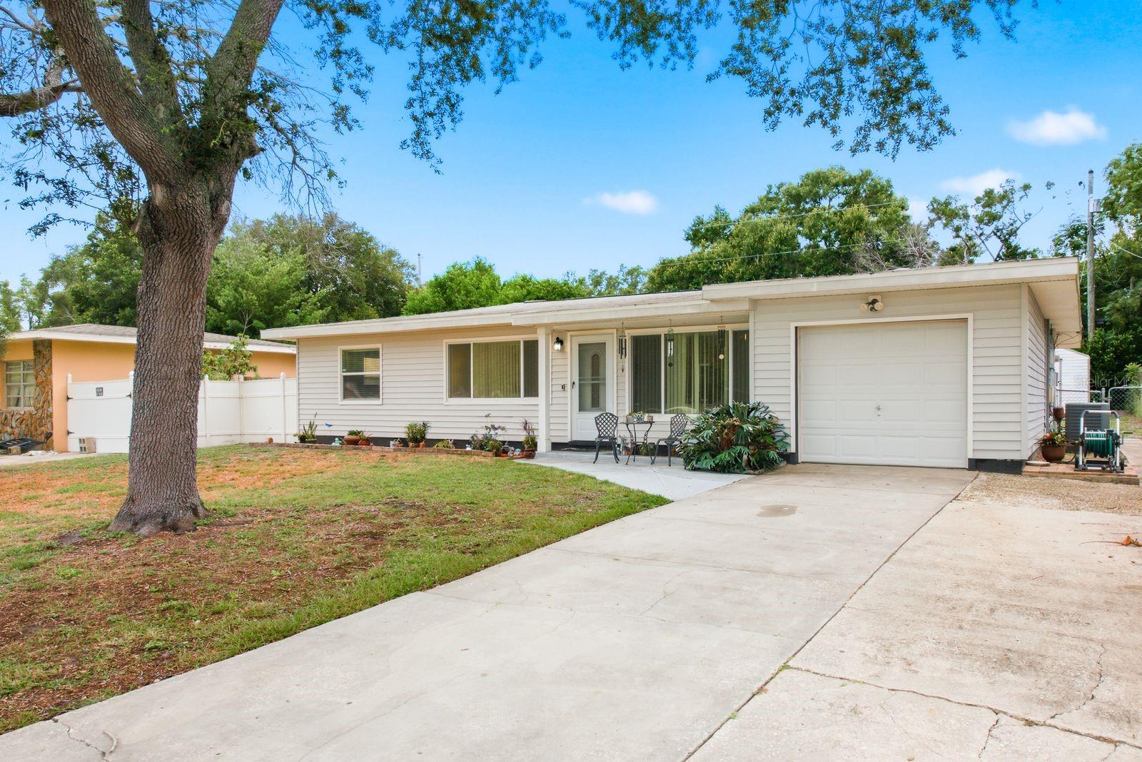 Amazing opportunity to own in Central Clearwater and make this great house your own!  Come see this 3 bed 2 bath 1 car garage home.  You'll notice the large yard with mature landscaping right as you drive up.  Once you enter the home you're greeted with a spacious living and formal dining room, kitchen and 3 good sized bedrooms.  You'll also have a bonus space that could be used as an office, craft area, etc.  In the spacious back yard you'll find plenty of room for a swingset, your pets to enjoy or even put in a pool!   There's a shed on property (with electric!) for your storage needs as well.  Roof is 2019, HVAC is 2019 and Water Heater is 2022. Located close to shopping, dining, entertainment and not far from Clearwater Beaches, this Flood Zone X house is ready for you to customize and make it your dream home!