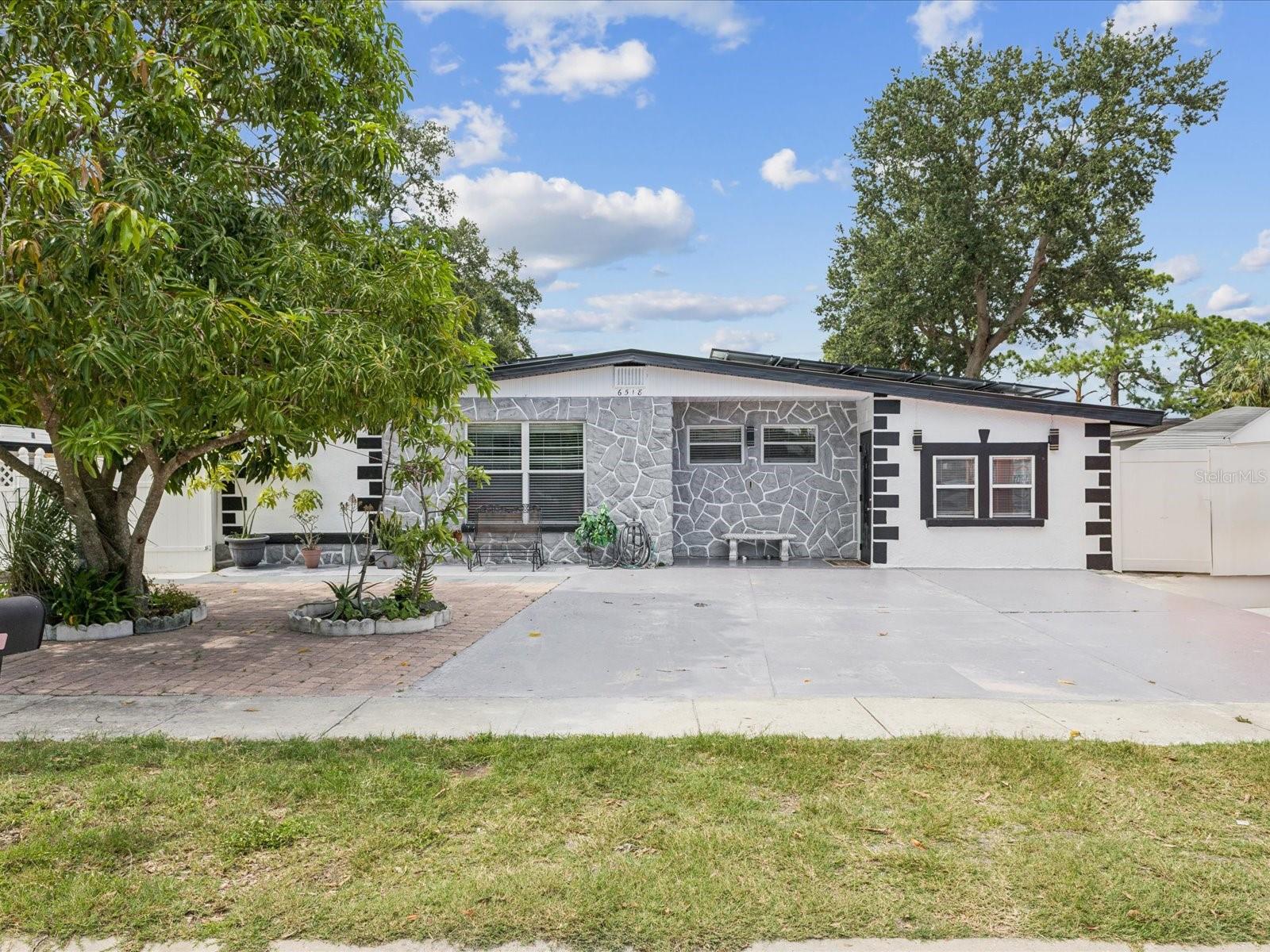 MEMORIAL DAY WEEKEND SALE!!! MOTIVATED SELLERS! PRICED WAY BELOW MARKET VALUE! Come see it to see its worth! This thoughtfully UPGRADED gem tucked in one of South Tampa’s most coveted neighborhoods offers the perfect blend of modern comfort, smart energy features, and unbeatable location. Just 4 MILES from MACDILL AIR FORCE BASE and under 9 MILES from TAMPA INTERNATIONAL AIRPORT, this move-in ready home places you at the heart of it all—near waterfront parks, the Westshore Marina District, Gandy Boulevard, and scenic Picnic Island. Step inside to fresh updates including NEW FLOORING (No Carpet) throughout, interior paint in modern tones, and sleek granite countertops that elevate the kitchen’s appeal. The layout offers open, airy living spaces ideal for entertaining or everyday life. A rare bonus is the PRIVATE IN-LAW SUITE located at the rear of the home, perfect for MULTIGENERATIONAL LIVING OR TURNKEY SHORT-TERM RENTAL with its own SEPARATE ENTRANCE—providing flexible use and added income potential. Enjoy peace of mind with a NEW ROOF INSTALLED WITH SOLAR PANELS, giving you sustainable energy savings for years to come and monthly electric bill of only $15-25 a month. 
This home also offers a BRAND NEW ELECTRICAL PANELS for enhanced efficiency and peace of mind. Even better, all PRE-LISTING INSPECTION ITEMS have been fully resolved, making this truly move-in ready for the next owner. Outside, the spacious yard offers room to relax, garden, or entertain under the Florida sun. Families will appreciate that this home is zoned for HIGHLY RATED MAGNET MIDDLE AND HIGH SCHOOLS, combining academic excellence with lifestyle convenience. Priced significantly below appraised value, this property presents an exceptional opportunity for both homeowners and investors alike. To provide additional transparency and confidence, the inspection report and appraisal report will be made available to buyers at no cost upon contract execution. Whether you’re searching for your next personal home or a smart investment opportunity in one of Tampa’s most desirable areas, this South Tampa stunner is a rare find. Schedule your private tour today before it’s gone!