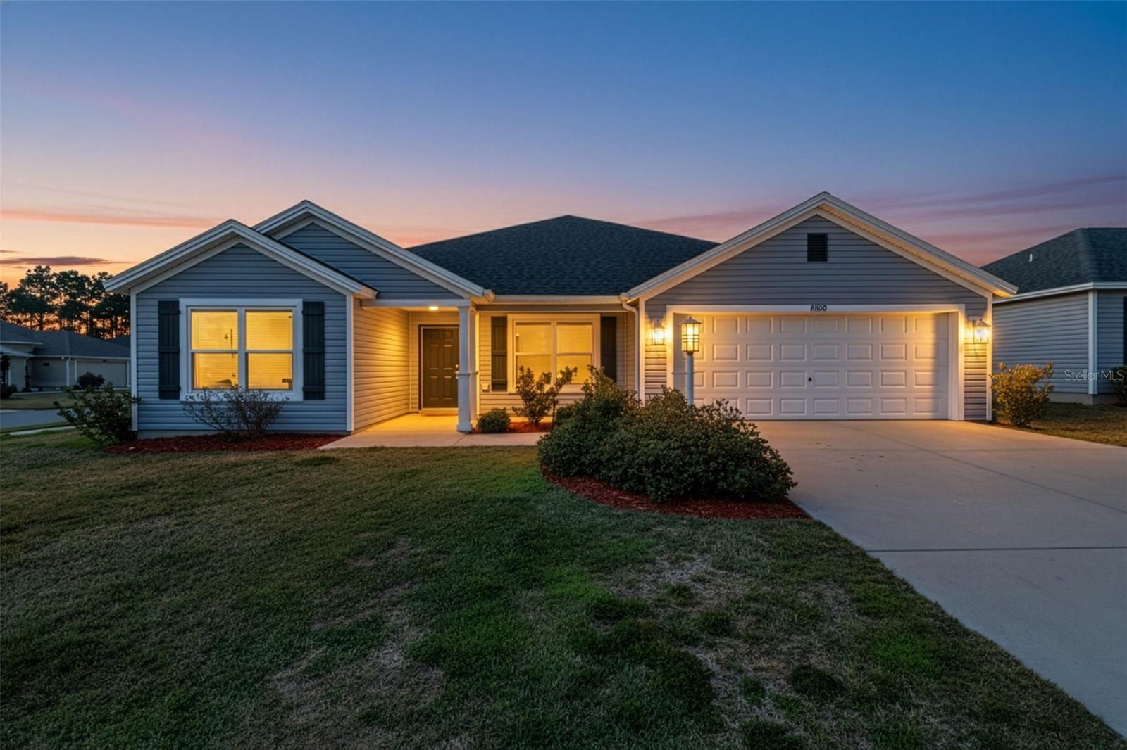 One or more photo(s) has been virtually staged. FABULOUS 4/2 home with SCREENED LANAI and OVERSIZED 22’x28’ GARAGE on a SPACIOUS CORNER LOT with ROOM FOR A POOL in the highly desirable, family-friendly, non-age-restricted, GATED community of Oxford Oaks! NO BOND! JUST MINUTES from The Villages retirement community, The Villages Charter Schools, and CR466 offering easy access to a plethora of shopping, dining, banking, medical and more! A charming FRONT PORCH, COVERED ENTRY VESTIBULE, and sidelit door welcome you in to the GENEROUS foyer. The interior of this GORGEOUS home features an EXPANSIVE OPEN LAYOUT with HIGH ceilings and LUXURY VINYL PLANK flooring throughout the kitchen and main living areas. The STUNNING GOURMET kitchen boasts NAVY and WHITE SHAKER cabinetry, NEUTRAL countertops, STAINLESS appliances, built-in DOUBLE PANTRIES with ROLLOUTS, corner LAZY SUSAN, and a CENTER ISLAND with EAT-IN breakfast bar. The VOLUMINOUS living and dining rooms feature FOUR-PANEL SLIDING GLASS DOORS that lead to the SCREENED LANAI. This FANTASTIC space overlooks the LARGE CORNER LOT and is ideal for ENTERTAINING friends and family or simply RELAXING with your morning coffee, evening cocktail, or a good book! Back inside, the luxurious primary bedroom features a TRAY ceiling, three windows, and a SPACIOUS WALK-IN closet. Its en-suite bathroom boasts NAVY SHAKER cabinetry, NEUTRAL countertops, DOUBLE sinks, LINEN closet, TILED WALK-IN shower, and a SEPARATE water closet. Near the foyer, a SPLIT FLOOR PLAN places two additional bedrooms and a second bathroom behind a POCKET DOOR creating PRIVATE sleeping quarters. Bedroom two offers DOUBLE windows and a built-in closet. The second bathroom features a NAVY SHAKER vanity with NEUTRAL top, and TILED tub and shower combination. The third bedroom boasts a LARGE window and a built-in closet. An additional separate fourth bedroom lies across the foyer, making it perfect for a quiet home office or guest room. It features DOUBLE windows and a built in closet. An INTERIOR laundry room boasts LVP flooring NAVY SHAKER cabinetry, shelving, and a built-in UTILITY SINK. Completing the package is an OVERSIZED 22’ x 28’ two car garage with PLENTY of room for parking ad storage! DON’T MISS YOUR OPPORTUNITY to make this AMAZING HOME YOUR OWN! The Oxford Oaks Community offers INCREDIBLE AMENITIES including: a Resort Style Swimming Pool; Pickle Ball, Tennis, and  Basketball Courts; Outdoor Exercise Equipment; and a fabulous Children’s Playground! All for a LOW HOA payment with NO ADDITIONAL FEES or BONDS! Conveniently located near the intersection of 466 and 301, Oxford Oaks is JUST MINUTES from The Villages retirement community, The Villages Charter Schools, and CR466 offering abundant shopping, dining, banking, medical, and more! DON’T MISS THE OPPORTUNITY to make this FANTASTIC HOME in an AMAZING LOCATION YOUR OWN! Please watch our walkthrough video and call today to schedule your Private Showing or Virtual Tour!