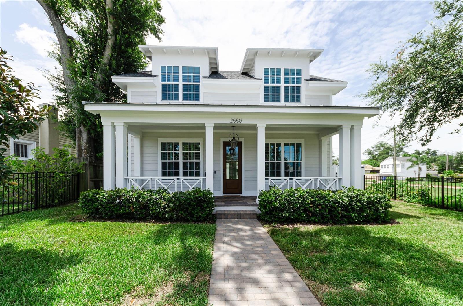 Virtually Staged. Welcome to this exceptional Canopy Builders home in the heart of Historic Kenwood!  This home was completed in 2024 with well-thought-out features and finishes including a stunning custom pool and spa, an electric vehicle charger and other thoughtful upgrades throughout.  The Low Country signature floor plan offers a timeless, classic design with a welcoming front porch, 10-foot ceilings, an open-concept great room, and a chef's kitchen with floor-to-ceiling shaker cabinetry, gas cooking and quartz countertops. The home includes impact windows, a tankless gas hot water heater, and two climate control HVAC systems.  The first-floor guest bedroom, plus a separate private
office, and a full bath provide flexibility, while upstairs features a spacious loft area,  a laundry room, two additional guest bedrooms, full bath with access from the loft and ensuite to one bedroom, and an inviting primary suite with dual walk-in closets and a spa-inspired bath.  The private backyard oasis includes a custom pool, covered lanai, and paver patio, perfect for entertaining and the detached two-car garage provides convenient alley access. The owners have loved the effortless layout of this beautiful home, from the walk-in pantry to the open kitchen overlooking the family room. Located in one of St. Petersburg's most cherished historic neighborhoods, you are just blocks from the Grand Central District filled with restaurants, local breweries, small boutiques and entertainment venues. Don't miss this fabulous opportunity to own a nearly new home with premium upgrades in a highly sought-after neighborhood just waiting for its new owner!