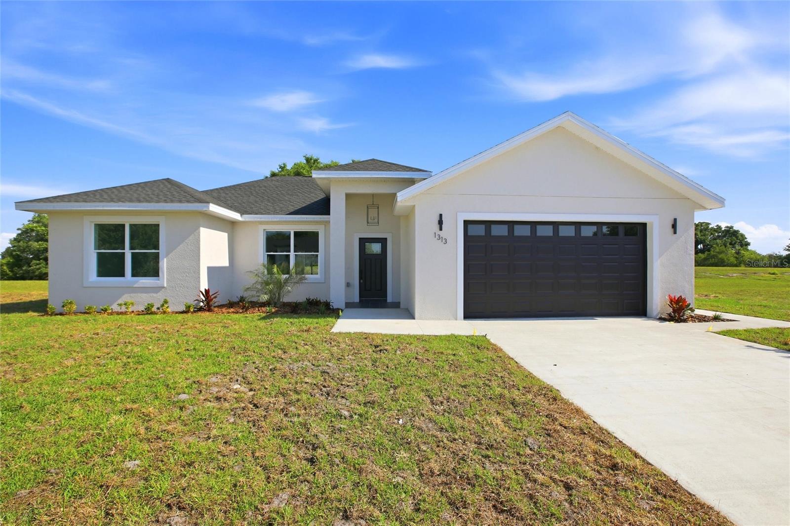 New Construction Opportunity in Sebring | Modern Comfort + Move-In Ready Discover this beautifully built 3-bedroom, 2-
bath home located in the desirable Sebring Country Estates, offering the perfect blend of style, comfort, and everyday
functionality. Designed with a split-bedroom layout, the home features a bright, open floor plan that makes both daily
living and entertaining feel effortless. At the center of the home, the kitchen stands out with stainless steel appliances,
generous cabinet space, and seamless flow into the main living and dining areas—ideal for gathering with family or hosting
guests. The private primary suite offers a relaxing retreat with its own en-suite bath, while the additional bedrooms are
thoughtfully positioned for flexibility, whether for guests, family, or a home office. Throughout the home, enjoy durable
wood-look laminate flooring, modern finishes, and ceiling fans that enhance the clean, move-in ready feel. Step outside to
a covered patio, perfect for enjoying Florida’s sunshine year-round, along with a spacious backyard ready for your vision—
whether that’s a pool, garden, or outdoor entertaining space. Additional highlights include a two-car garage with ample
storage and a convenient interior laundry area. Situated in a growing Sebring location with strong potential, this property
is a great opportunity for buyers seeking new construction and long-term value. Schedule your showing today and come
see all that this Sebring home has to offer.
