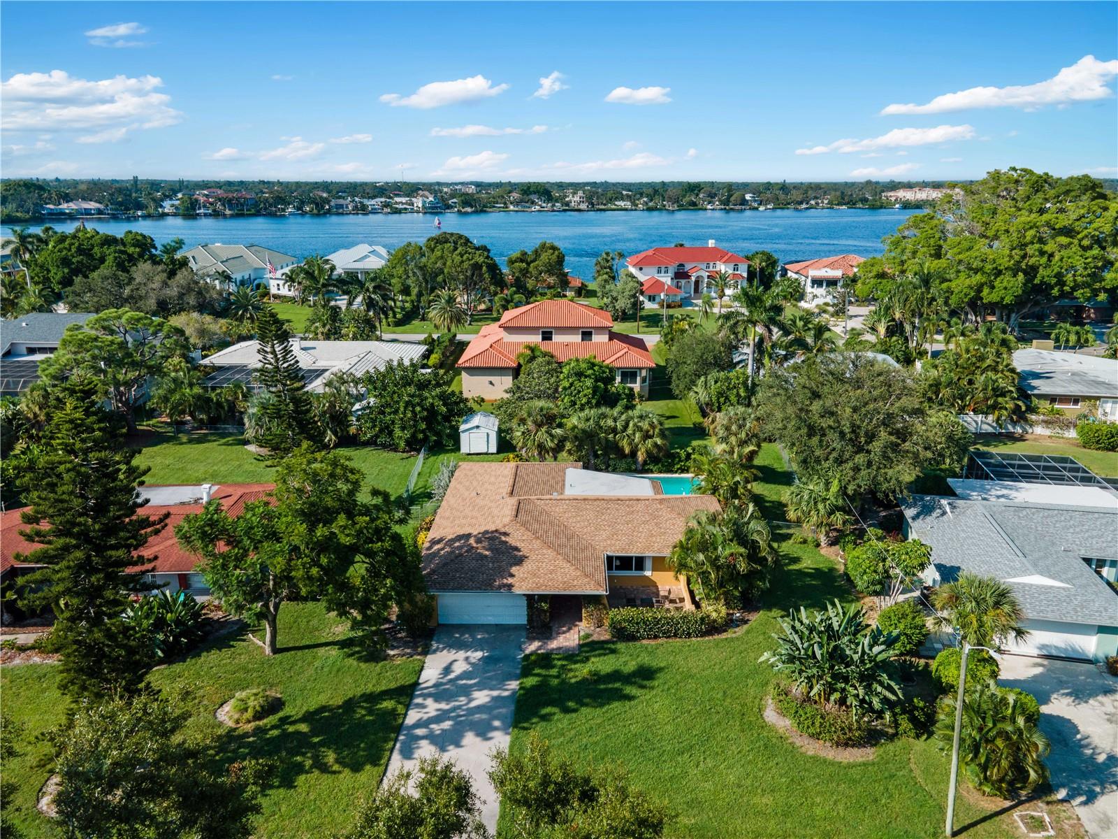 Discover the charm and endless possibilities of this inviting 3-bedroom, 2-bathroom pool home, ideally located just minutes from the breathtaking beaches of the Gulf of Mexico and the vibrant energy of historic downtown Venice. Enjoy easy access to boutique shopping, parks, and an array of exceptional restaurants all while savoring the comfort of coastal living. A newer roof installed just three years ago provides added peace of mind. From the moment you arrive, the welcoming front porch sets the tone for what’s inside. The thoughtfully designed split floor plan offers privacy, while the spacious living room is filled with natural light and opens through sliding glass doors to the pool and backyard, creating a seamless indoor-outdoor flow. The kitchen features a microwave hood, coil stovetop, and a cozy breakfast nook, perfectly positioned for everyday living and entertaining. The spacious primary suite serves as a private retreat with direct pool access, a large walk-in closet, and an en-suite bathroom with a walk-in shower. Two additional guest bedrooms share a well-appointed bathroom, providing comfortable accommodations for family or visitors.
Step outside to your private, fenced backyard oasis, complete with a generous pool area, outdoor seating, and a convenient outdoor shower — ideal after a day at the beach. A backyard shed offers additional storage, while the two-car garage provides ample space for parking and organization. Located in one of Florida’s most beloved Gulf Coast communities, Venice is known for its beautiful beaches, welcoming atmosphere, and relaxed coastal lifestyle. From boating and fishing to art festivals and outdoor concerts, this home offers the perfect blend of comfort, functionality, and coastal charm. Ready for you to make it your own.