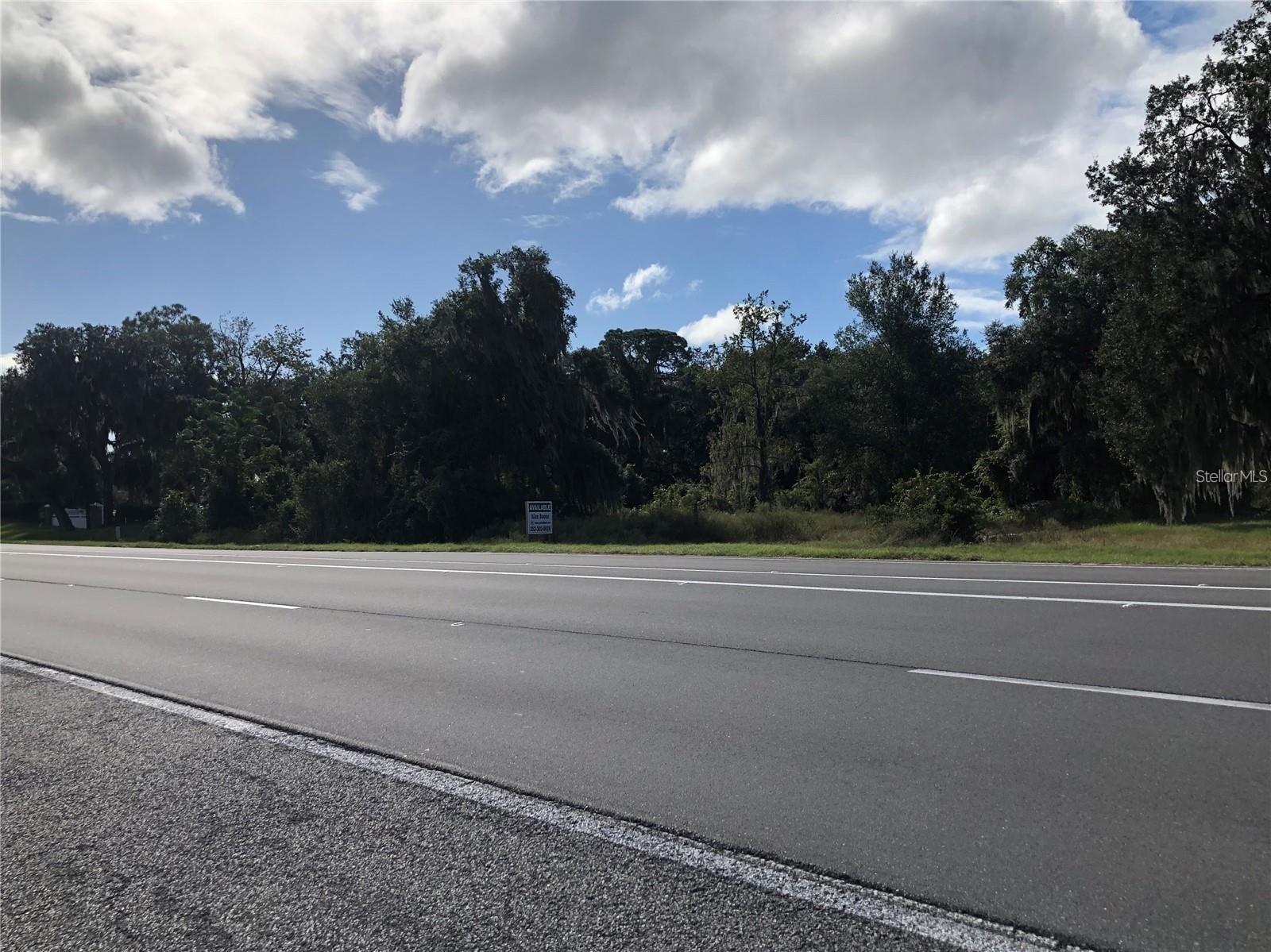 6981 E State Road 44, Wildwood, FL 34785.   2 ACRES OF Commercial  land  that which is the only direct highway access off of highway 44 into the vicinity..One acre frontage and another acre situated in back of it..The land is adjacent  to the Continental County Club off highway 44 in a prime setting surrounded by restaurants, New Walmart,medical centers.