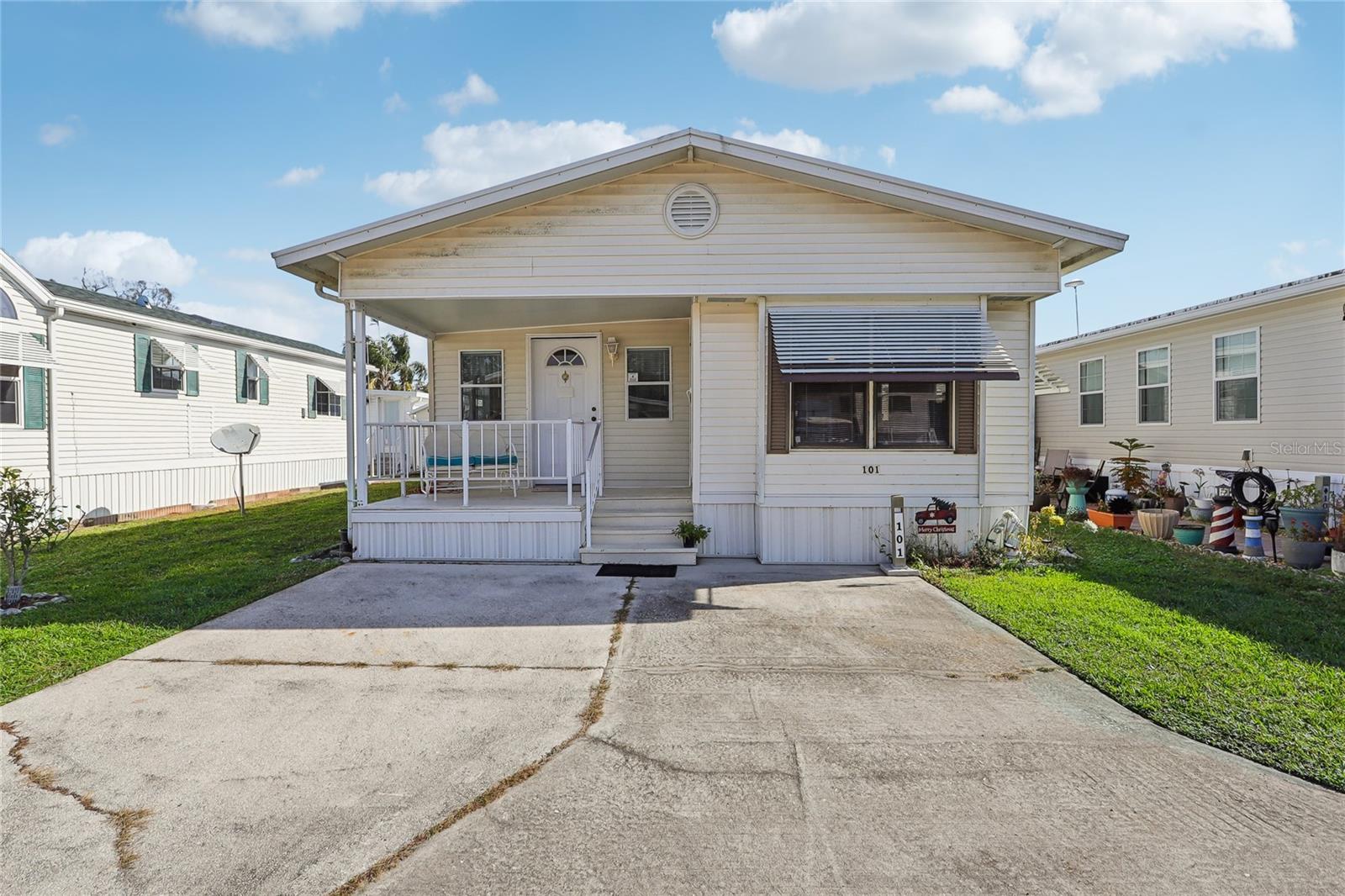 Welcome to Citrus Ridge, a charming 55+ community located in Davenport, and close to all the attractions and I-4! This
is NOT lot rent - you own the land! This home has had some recent updates and is ready for its new owners! NO
polybutylene piping--- the home was completely repiped! The floors are super solid as well! The home just needs your
finishing touches on design, but is move-in ready as is as well! Driving to the property, you'll notice the oversized
parking pad that can comfortably fit two vehicles. A front porch greets you, perfect for enjoying your morning coffee
on. When you enter the home, you'll enter the kitchen and dining room. There is eating space in the kitchen, and the
home is also set up with a desk and chair, perfect for a home office. Heading to the back of the main home, you'll find
the full bathroom, with a shower/tub combo, and the primary bedroom is at the back of the home. The living space
continues into the addition. Starting from the back, you have a second bedroom / den that features a closet with the
washer and dryer (yes, this has INSIDE laundry!). There is also a half bath, and then the living room in the front of the
home. Outside, you'll find a generous storage shed. The yearly HOA fee covers maintenance of the roads, pool and
other common areas, trash removal and lawn service. Owners are responsible for their trees, flowerbeds and other
plantings. Park amenities include three laundry and bath house buildings; heated swimming pool and spa; shuffleboard;
horseshoe court; and a petanque court. There is also a clubhouse for meetings, exercise class, shows, bingo, dances,
craft and flea market events, cards, luncheons and pot luck dinners and line dancing classes. Finally, there is an activity
hall for meetings, Bible study, library, reading room with puzzles, cards, exercise equipment room, arts and crafts,
private parties. You can find a calendar of events on the association's website.