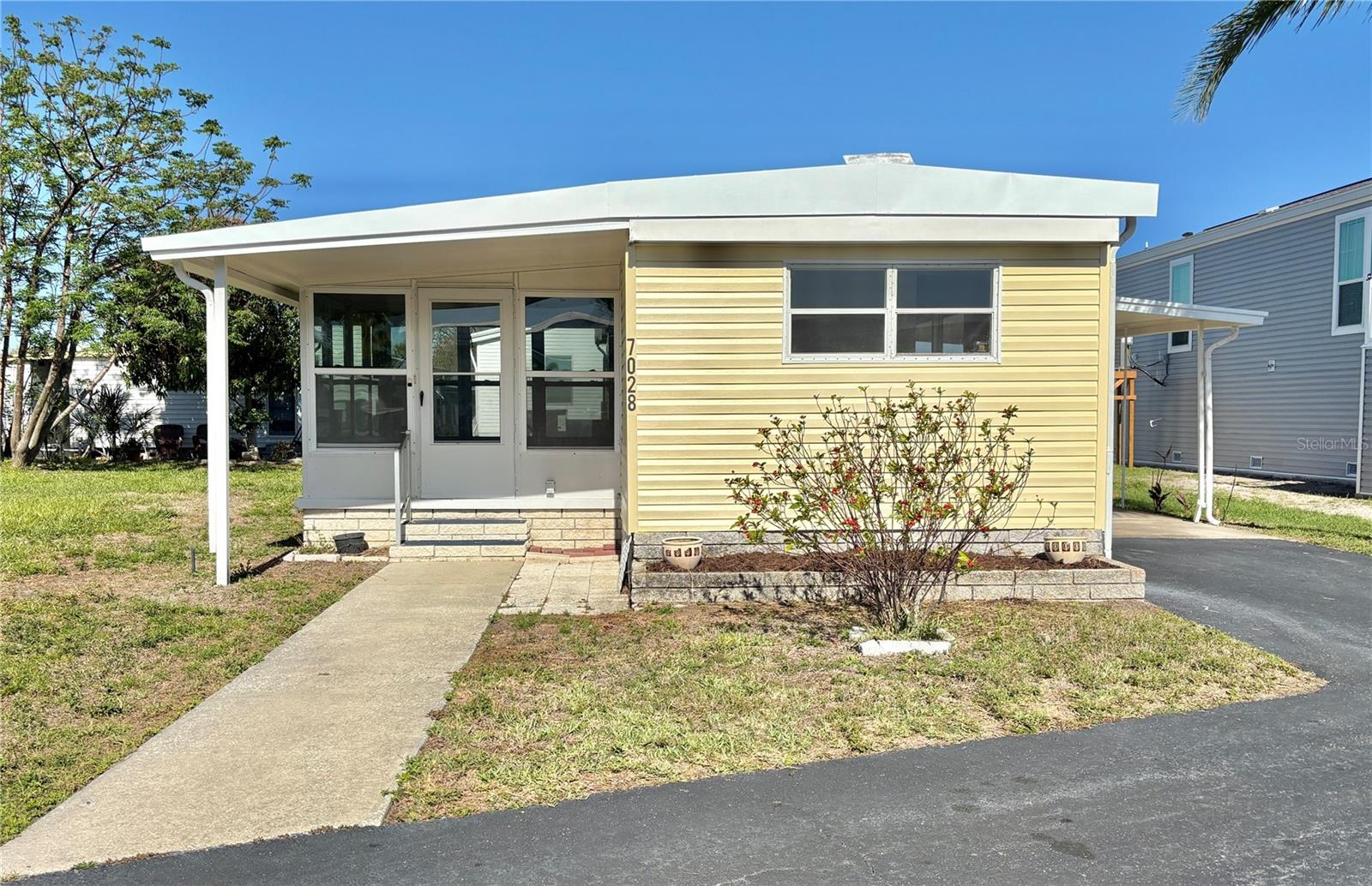 Annual rental in popular 55+ community! You'll enjoy this 2 bed/2 bath home that was totally remodeled in 2026! Split bedroom plan for extra privacy, the beautiful remodel includes wide-plank waterproof luxury vinyl flooring throughout--no carpet! New kitchen with stainless appliances, new cabinets and granite countertops, luxury baths with walk-in showers for ease of use, a 160 sq ft Florida room to enjoy the outdoors, inside washer and dryer, 2025 roof, 2023 HVAC system and 2026 electrical panel. Driveway with one-car carport holds two cars easily. Shed in back for extra storage. Monthly fee is $1495 and includes water, sewer, trash pick up, lawn mowing, 24 hr manned gate, private streets and all amenities including heated pool, fitness center, clubhouse, billiards, two private boat ramps, kayak launch and so much more! More than 30 clubs to enjoy. Tenant pays for electric and cable/internet. Americana Cove is a 55+ waterfront community located only 10 mins to downtown St. Petersburg, 20 mins to two airports and 3 mins to 4th St. shopping, dining and grocery. Two pets (dogs or cats) up to 35 pounds each are welcome. $250 nonrefundable pet deposit. This is the retirement community that you've been waiting for! Background/credit check required.