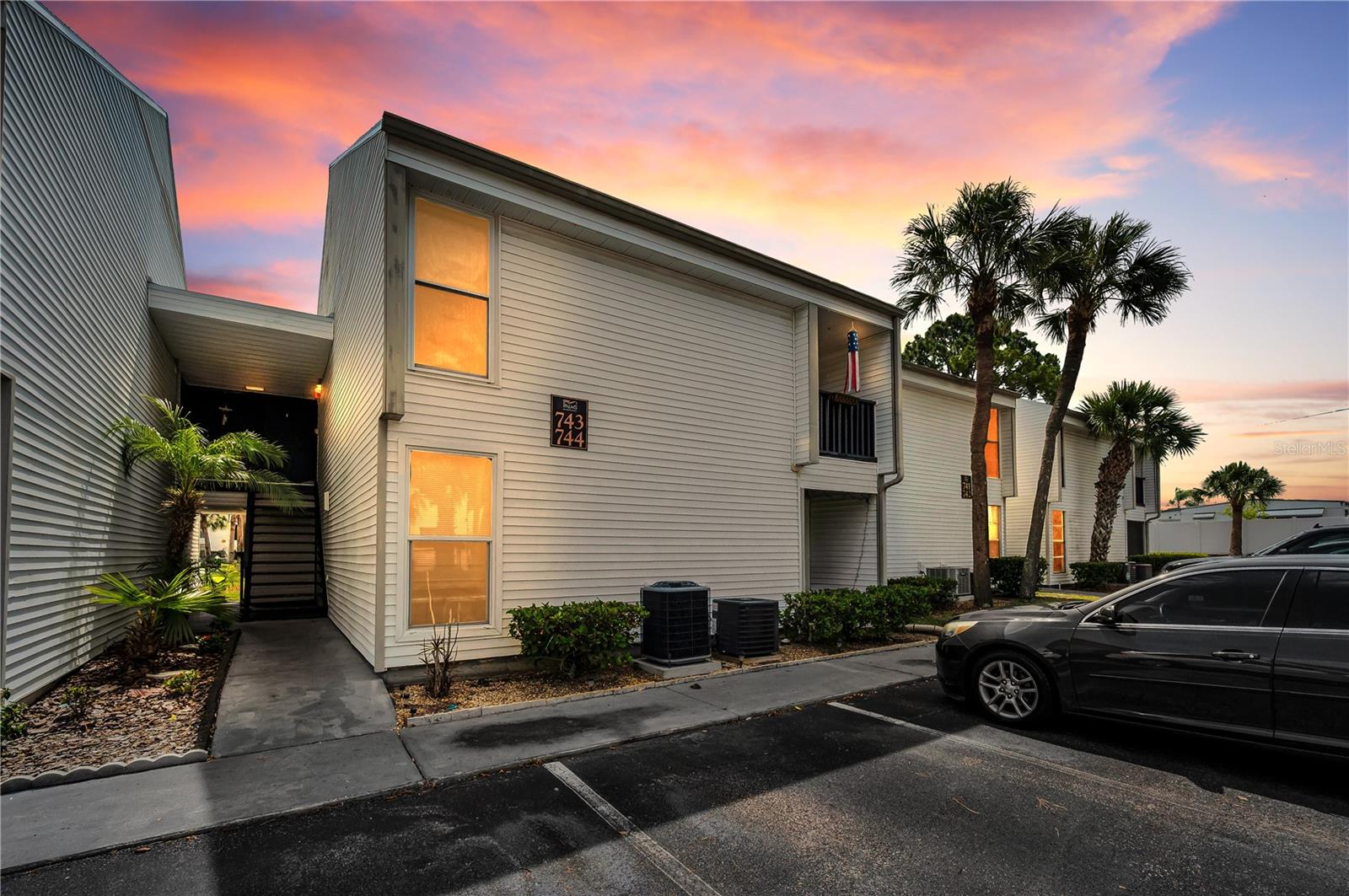 Welcome to carefree Florida living in the desirable Tarpon Springs community of Palms of Tarpon Springs! This beautifully maintained 2-bedroom, 2-bath residence offers a bright and open layout designed for comfort and convenience. A/C 2024. Enjoy spacious living and dining areas, a well-appointed kitchen with ample cabinetry, and a private primary suite featuring an en-suite bath and generous closet space. The split-bedroom floor plan provides added privacy for guests or a home office setup. Relax on your screened in private patio/balcony and take advantage of the community amenities. Nearby is the  world famous Sponge docks, with multiple Greek food restaurants, distilleries, plenty of shopping, quaint boutiques, bakery, visit the aquarium, or attend festivals and events throughout the year along the Sponge docks. Or you could take a bike ride to the beautiful nearby Sunset beach, Fred Howard Park beach or take the Pinellas trail to downtown Palm Harbor, Crystal beach pier, Dunedin causeway, Honeymoon Island and Clearwater beach. Close to hospitals, centrally located to all amenities with easy access to St Petersburg and Tampa international airport. Whether you are looking for a full-time residence, seasonal retreat, or investment opportunity, this home is a must-see!