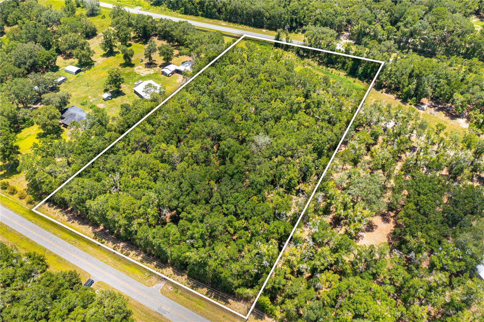 NOW is your chance to own a slice of rural paradise in The Meadowlands! This exceptional 5.1-acre homesite is beautifully wooded with mature timber, offering the perfect setting to build your dream home or place a manufactured home in a quiet and peaceful country setting. This versatile property features paved road frontage on both the front and rear, providing convenient ingress and egress from two roads. A curb cut with an installed driveway culvert is already in place on SW Meadowlands Drive, and electric service is readily available, making your future build even easier. The property is fenced on three sides and includes a buried pipeline easement across the rear that remains free of trees—an ideal location for a garden, pasture, or grazing area for horses or cattle. Enjoy the tranquility of country living without sacrificing convenience. Located within 3 miles of highly rated schools, approximately 5 miles from the new Publix shopping plaza and Tractor Supply, just minutes from Lake City, and I-75, this property offers an easy commute while keeping everyday necessities close at hand. With no HOA restrictions, you'll have the freedom and space to bring your vision to life—whether you're ready to build your forever home, invest for the future, or create your own private homestead. Benefit from lower Columbia County property taxes while being just minutes from the crystal-clear waters of world-famous Ichetucknee Springs State Park, and Historic Downtown Lake City with it's delightful eateries and breweries. You'll be ideally situated between High Springs and Lake City, and only 35 minutes from Gainesville, this outstanding property combines privacy, convenience, and endless potential. Located outside the flood zone. Buyer is responsible to confirm accuracy of all measurements, all legal and zoning requirements and land use. P.S. Seller may be agreeable to financing up to 50% of the purchase price!
Don't miss this incredible opportunity—schedule your visit today!