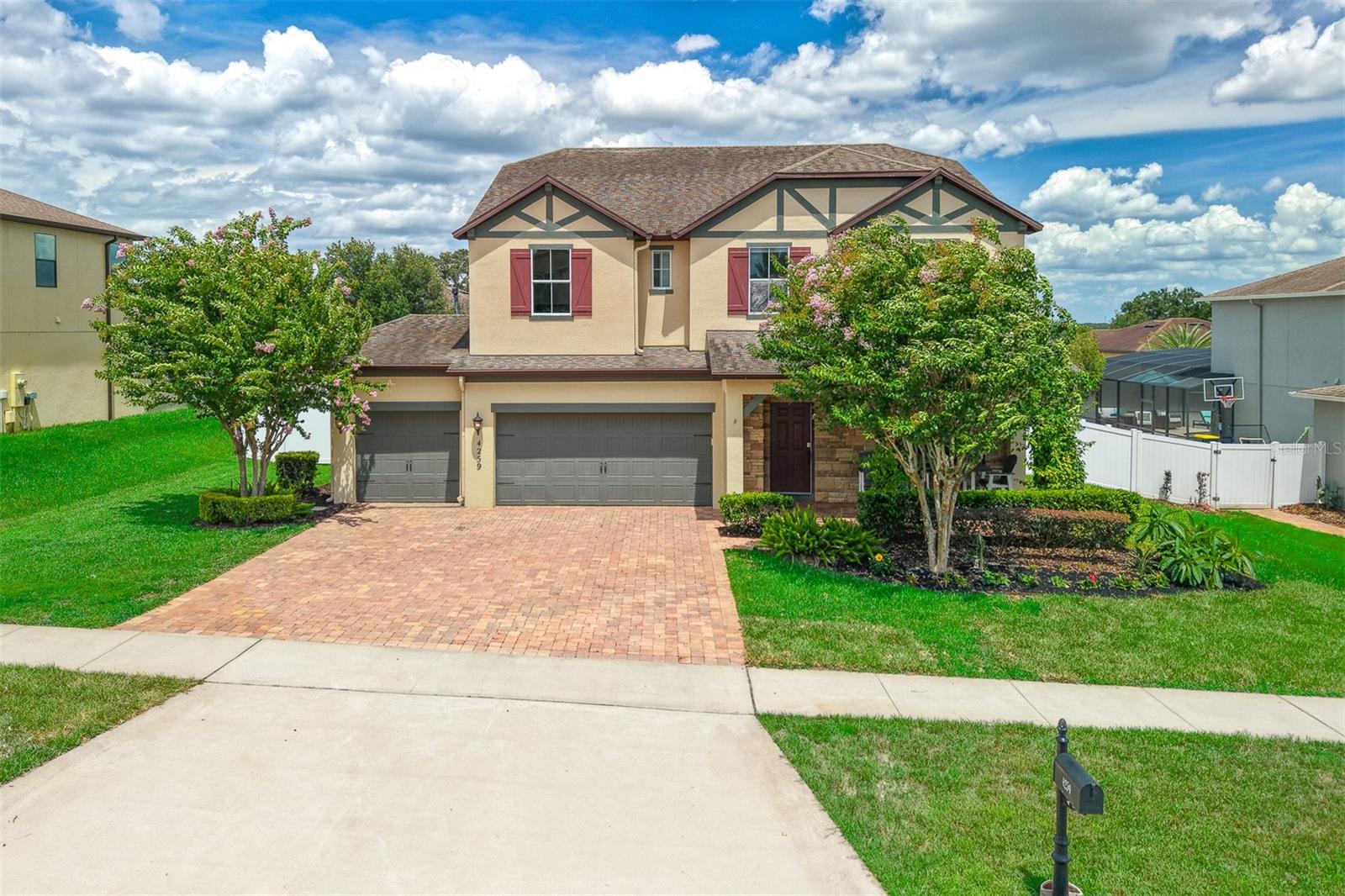 Welcome to this exceptional 6-bedroom, 4-bathroom pool home located in the highly desirable Hunters Run community in the heart of Clermont. Known for its spacious homes, convenient location, and strong sense of community, Hunters Run is one of Clermont's most sought-after neighborhoods. This beautifully maintained residence combines generous living space, thoughtful upgrades, and an incredible outdoor retreat, making it the perfect place to call home.

Step inside and discover a bright, open floor plan designed for both comfortable living and effortless entertaining. The gourmet kitchen is a chef's dream, featuring a natural gas cooktop, stainless steel appliances, quartz countertops, an oversized pantry, and abundant cabinet space. The adjacent breakfast nook includes a dry bar with two beverage refrigerators, creating the perfect setup for hosting family and friends.

Designed with flexibility in mind, the home offers multiple living and gathering spaces along with a dedicated office featuring a closet, making it ideal for remote work, a study, hobby room, guest space, or other evolving household needs. Numerous quality improvements throughout the home, including updated flooring, kitchen enhancements, upgraded lighting, and a fenced backyard, contribute to its move-in-ready appeal.

Step outside to your private backyard oasis featuring a heated pool and spa enclosed within a large screened lanai. The pool system includes Wi-Fi-enabled controls, allowing you to conveniently manage pool and spa settings from your smartphone. Whether you're enjoying a quiet evening under the stars, hosting weekend gatherings, or spending sunny Florida afternoons poolside, this outdoor living space is sure to become a favorite destination year-round.

Additional features include a spacious 3-car garage with a built-in workbench and shelving for tools and storage throughout the home.

Ideally located near shopping, dining, major roadways, parks, and top Clermont attractions, this home offers the perfect balance of comfort, convenience, and lifestyle. Opportunities to own a home of this caliber in Hunters Run are rare. Schedule your private showing today and experience everything this remarkable property has to offer.