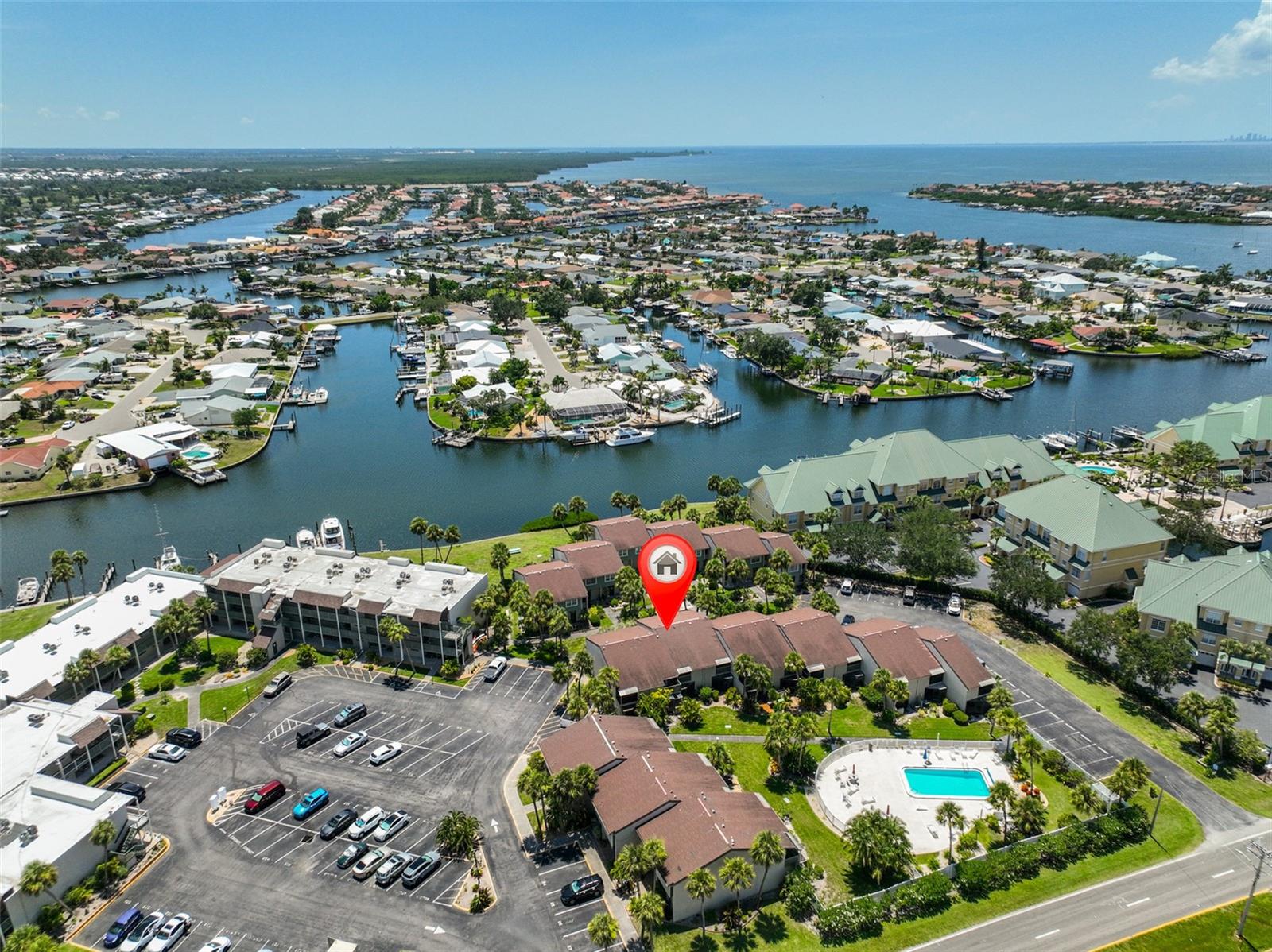 Great Value! Seller compensation offered of 1 year paid association dues!
The waterfront community of Anchor Point has a lovely 2 bedroom, 2 bathroom fully furnished turn key townhouse style condo unit for sale. This is the perfect unit to call home, use as a second home or as an investment for monthly rental.  The unit has been updated with easy care wood look ceramic plank tile throughout the first floor.  New shaker style white cabinet, granite countertops, white subway tile backsplash and pots, pans, dishes, utensils, and appliances make the kitchen bright and efficient.  There is a large pantry and extra storage under the stairs.  The kitchen leads to the comfortable dining and living area and cozy screened lanai with outside storage. The 2 bedrooms featuring a primary suite with a walk in closet, full bathroom, and a private balcony, an additional bathroom and a laundry closet with a full sized washer and dryer and linen closet complete the upstairs. 
Cool off with steps to the community pool or gather with friends in the community center with indoor and outdoor spaces available. Sit by the water and check out the dolphins and other sea life.
Docks are available for $170/month.  (Best bargain around!)