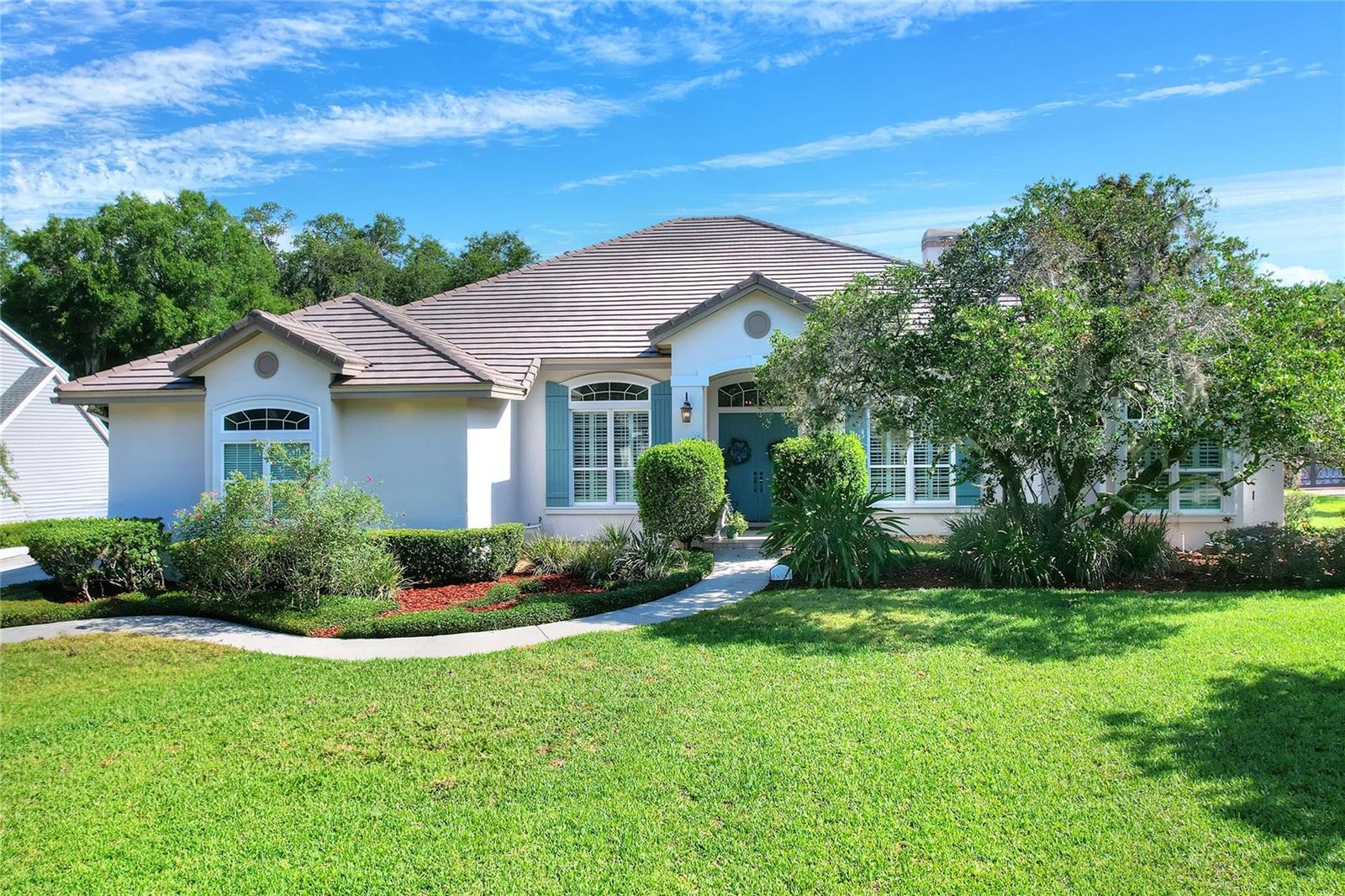 South Lakeland 5 bedroom, 4 ½ bath, plus office located in the private, gated community of Lake in the Woods. The interior layout of this desirable 1-story home, completely remolded in 2018, features an open floor plan and high ceilings. As you enter the home, you will find a large den with glass doors that can be used as an office, bar or formal living area. The large dining room with swinging door leads to the beautiful high-end kitchen. This custom kitchen and eating area opens to a spacious family room that are both made light and airy by the high ceilings and abundance of natural light flowing from the windows and glass doors. The open kitchen includes Waypoint and Showplace cabinetry, quartz countertops, high-end gas range plus built-in microwave that can be used as an oven, a large bar with seating overlooking the family room and an island with maple wood countertop. Behind the kitchen you will find a large butler’s pantry/laundry room combo featuring the same custom cabinetry as the kitchen with a pantry, full sink, extra storage and large counter area for food prep. Great for entertaining! The primary suite includes walk-in shower, dual vanities, soaking tub, water closet and large walk-in closet! The 5th bedroom adjacent to primary bedroom can be used as a nursery, office or home gym. This triple split floor plan includes en suite bedroom with access to pool/lanai area, plus 2 other bedrooms with specialized shared bathroom layout, featuring two private vanities and toilets (one for each bedroom) that connects to a central, shared shower/air tub. This design boosts privacy, allowing users to share the wet area while retaining individual sink areas. The large screened lanai area with pool overlooks the lovely, private lawn and mature landscaping. The oversized 3 car garage includes an EV charger. Some of the amenities found throughout this stunning home include exquisite wood work, recessed lighting, wood floors and lots of storage not to mention a new roof and A/C units. This is a beautiful home in one of Lakeland's exclusive communities. All for $1,100,000.
