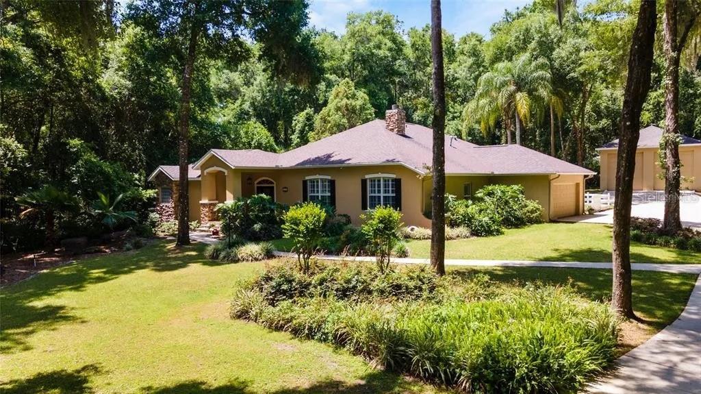 You will love this spacious Mediterranean-style custom built pool home, with an indoor courtyard! It is located in the heart of Ocala in a rural neighborhood just minutes from the world famous equestrian center and ongoing yr.round towne-square events.
         Recent updates include newer roof(2021) new salt-cell for pool generator, new panel (A/C/heat) control zoned for 4 areas covering entire house including separate fully contained in-law suite. Also built in 2012 Separate double door  GARAGE RV/workshop building WITH upstairs. House additionally   Includes 1000 gallon  underground
propane tanks.house generator and full house alarm system. All of this is Located on over 1 semi-secluded rural acre within a mile of town. This one of a kind uniquely built European-style home was well planned out from start to finish. If you're seeking
a peaceful and quiet spot near everything look no farther.