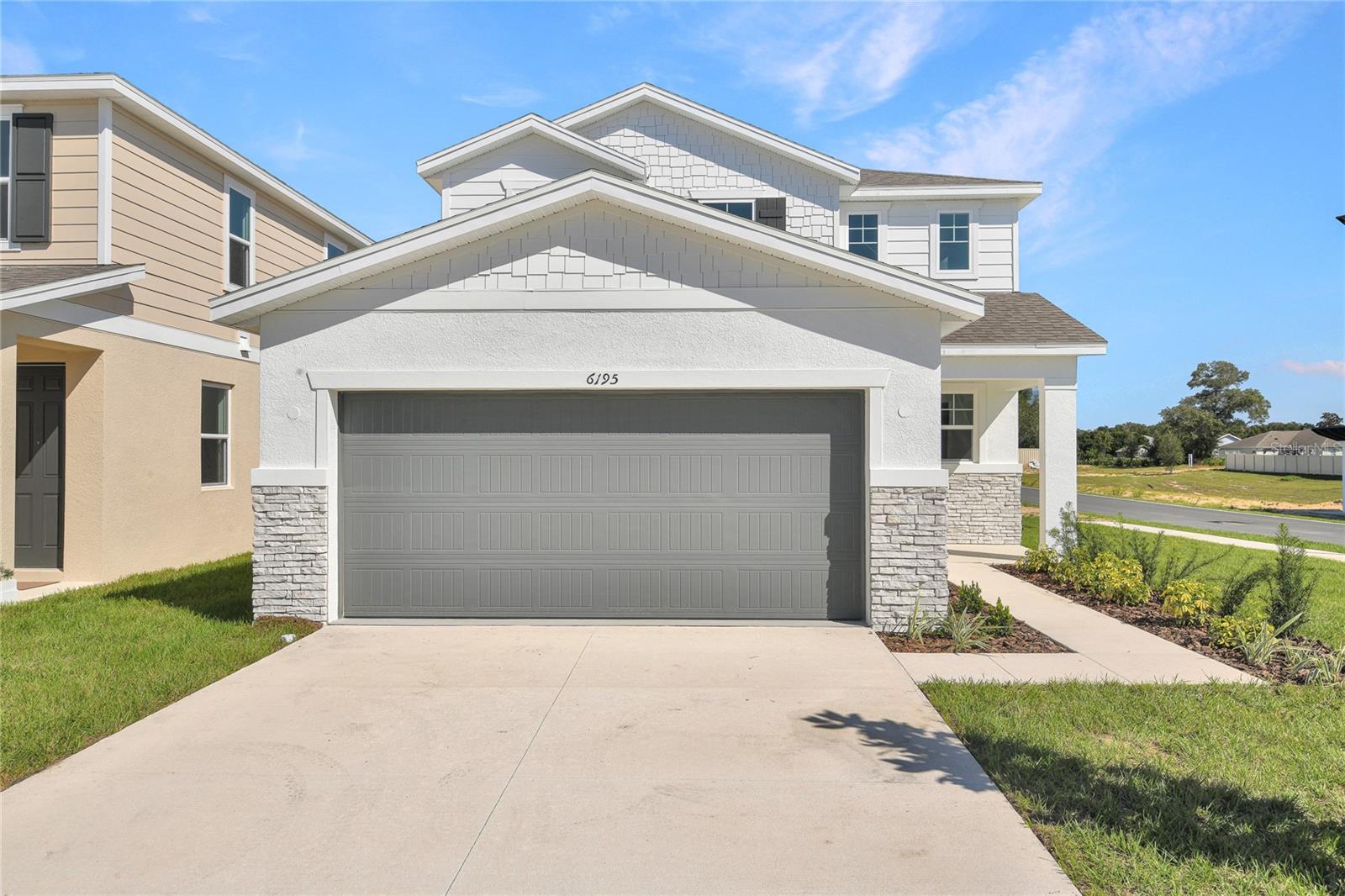 The Palm features two stories of smartly designed living space. On the main floor, an inviting kitchen is flanked by a great room and a dining nook—offering access to a relaxing covered patio. A mud room provides a convenient entry point from the garage, and has a Bedroom with a full bath on the first Floor. Upstairs, a loft provides another versatile hangout. Other second-floor highlights include a laundry room, a full hall bath and three bedrooms—including a generous owner's suite with a private bath and walk-in closet. Upgrades include, 9'4" ceilings with 8' doors on main floor, Bedroom with full bath on first floor, Double sink in m bath and guest bath, covered patio, Elevation A, Smart Thermostat, Kitchen vent to outside, Optional window at Bath 2, Range, Dishwasher, Microwave, Elongated Toilets, Glass shower enclosure to m bath with Chrome Frame, Upgraded white cabinets with 42" uppers, White Quartz countertops to Kitchen and in guest baths, Chrome faucets in all Baths, upgraded Chrome kitchen faucet, Carpet on second floor except wet areas and in Bedroom on 1st floor, 7 x 22 Ceramic tile flooring to first floor (except Bedroom) and all wet areas upstairs, Smart Garage door opener, Coach light Prewire with switch, upgraded single bowl sink to Kitchen, Video Doorbell, R-38 Insulation, and Hybrid hot water heater.