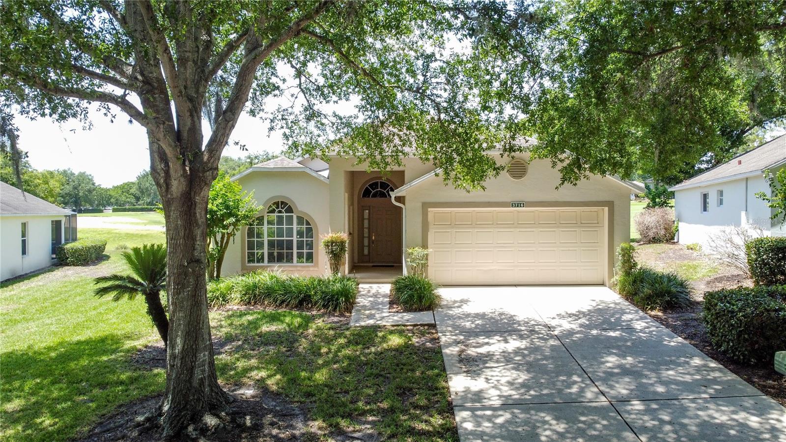 Home is priced to sell!! Great views from this Kent model located on the 18th hole of the Kings Ridge Championship course. Kings Ridge is a 55+ gated golf community located in the rolling hills of Clermont. Home has 1572 heated Sf with 2 BD/2 BA, plus Den and a 2 car garage.   New roof in April 2018 and a new HVAC in 2018. The water heater has been changed out. Home has carpet throughout all main areas and tile in wet areas. The kitchen has pickled oak cabinetry, white Formica countertops and white appliances. The Primary bath has a walk in shower w/bench and a single vanity. The large back lanai has tile flooring and is enclosed with vinyl windows. There is a separate laundry room and washer and dryer remain.  Enjoy the Kings Ridge Royal life style in the multimillion $ clubhouse with 3 heated pools, spas, tennis & pickle ball courts, billiards, shuffle board, shows, Bingo, cards and clubs galore. The monthly maintenance fees include: lawn maintenance including trimming of shrubs, care of irrigation system & irrigation water, Spectrum for internet & cable TV, maintenance of roads and outside painting of home every 7 years. Take your golf cart to the Kings Ridge Plaza where you can do your grocery shopping, banking or dine out..