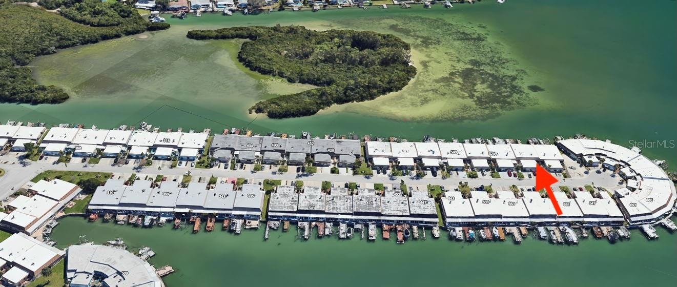 Virtually Staged. Virtually Staged. LIVE YOUR DREAM VACATION LIFESTYLE EVERY DAY IN THIS PRISTINE WATERFRONT VILLA. Widely recognized as one of the best lots in the community, this fully renovated single story unit simply dazzles. New flooring, new immaculate quartz counter tops, new cabinets, new bathrooms, new appliances—it’s all here for you! The sleekly redesigned kitchen and Owner’s Suite both feature walls removed to open the space and enhance the flows. The split floorplan offers privacy between the primary and the second bedroom, which can double as an office. The second bedroom has its own entrance from the welcoming front courtyard via new hurricane sliders, and the oversized primary offers spectacular water views with its own entrance to the sunroom. A bright, full garage provides loads of storage and private parking, and a visitor lot next door offers plenty of convenient guest parking. The real star of the show is the view—near end of the southernmost peninsula in the complex, with magical and unobstructed views of the intracoastal waterway and easy access to the Gulf of Mexico. Luxuriate in your living room or your newly screened and updated lanai and marvel at flocks of sea birds in the island preserve while porpoises and manatees play just off your paved deck. Watercolor sunsets beckon nightly. This is Florida living at its finest. A 55+ Waterfront GATED community, Boca Ciega Point offers a huge array of amenities and social activities including two refurbished clubhouses, fitness center, a large salt-water pool, sauna, tennis and pickle ball courts, bocce ball, a putting green, a boating club, and more—all minutes from shopping and world-class beaches. It’s a must see! Call today for your private showing.