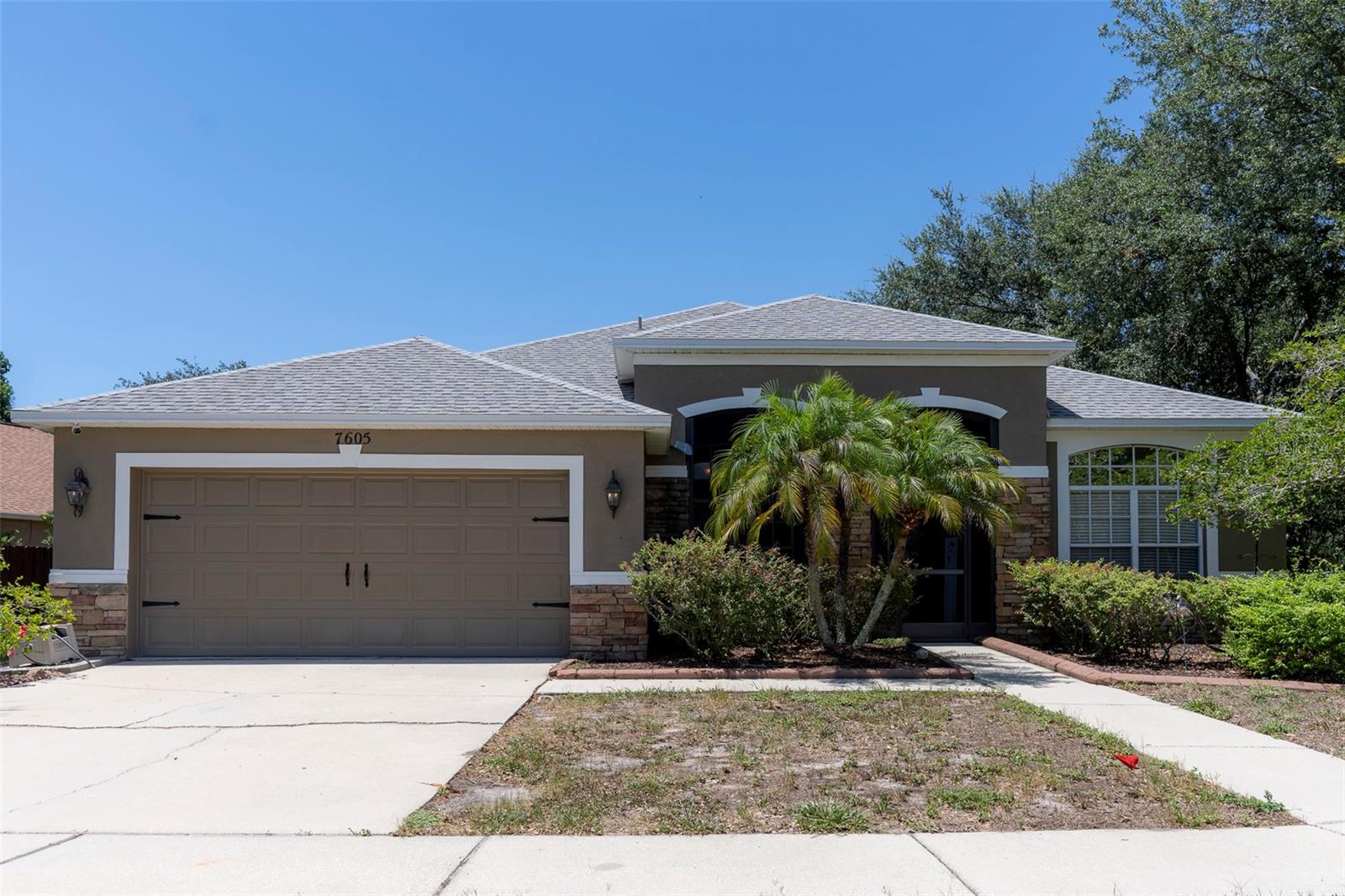 Welcome to this beautifully maintained former model home, situated on a spacious corner lot in the desirable Covington Park community of Apollo Beach. This move-in-ready home offers a rare opportunity for qualified buyers to assume a VA loan with a 5.74 interest rate, potentially resulting in substantial monthly savings compared to today's market rates.

Offering nearly 2,500 square feet of thoughtfully designed living space, this home features 3 bedrooms, 2 bathrooms, a dedicated office/den, formal living and dining rooms, an expansive great room, a breakfast area, and a versatile bonus room, providing exceptional flexibility for today's lifestyle.

A screened front porch welcomes you inside, where vaulted ceilings and abundant natural light create an open, inviting atmosphere. The formal living and dining rooms frame the entry, while the heart of the home showcases the spacious great room, kitchen, and breakfast area beneath impressive 12-foot ceilings.

Designed with both style and function in mind, the kitchen features updated appliances, including a natural gas range, 42-inch cabinetry, Corian countertops, a pantry, breakfast bar, stylish backsplash, and abundant prep and storage space.

The privately situated owner's suite offers a peaceful retreat with a vaulted ceiling, charming window seat, large walk-in closet, and an ensuite bath featuring dual vanities, a soaking tub, separate shower, and private water closet. Two additional bedrooms and a full bath are located on the opposite side of the home, creating a desirable split-bedroom floor plan. A dedicated office provides an ideal work-from-home space, while the enclosed bonus room offers endless possibilities as a media room, playroom, fitness room, hobby room, or additional flex space.

Recent improvements include:
• New roof (2023)
• New fence (2023)
• HVAC system (2021)
• Kitchen appliances (2019)
• Fresh interior paint (2025)
• New backyard sod (2026)

Step outside to the oversized 15' x 40' covered and screened lanai overlooking the fully fenced backyard—an ideal setting for year-round entertainment, family gatherings, or relaxation.

Covington Park residents enjoy an exceptional amenity package featuring two community pools, playgrounds, picnic pavilions with grills, volleyball, tennis and basketball courts, multipurpose sports fields, scenic ponds, and miles of walking and biking trails.

Conveniently located just minutes from I-75, US-41, and US-301, this home offers easy access to shopping, dining, medical facilities, schools, daycare centers, and downtown Tampa.

With major system updates already completed, a spacious and flexible floor plan, and the rare opportunity to assume a 5.74 interest rate VA loan, this exceptional home is ready for its next owner. Schedule your private showing today.