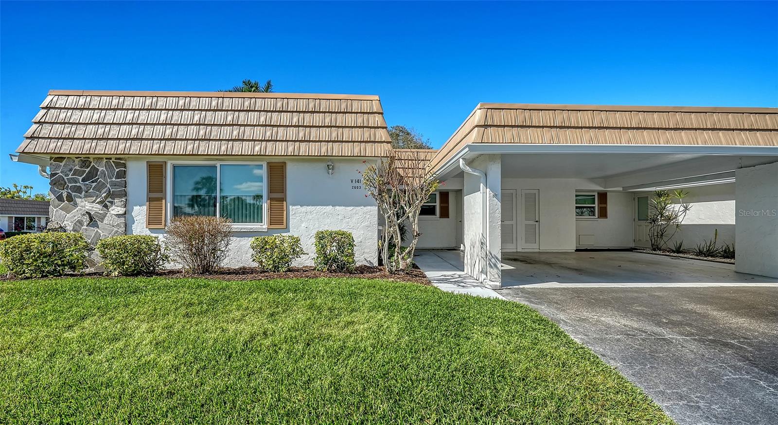 In Strathmore Riverside, a well-maintained and socially active 55-plus community, this beautifully updated two-bedroom, two-bath corner villa offers space, comfort and exceptional value. The open floor plan is enhanced by attractive wood flooring throughout, while the thoughtfully designed layout includes a welcoming main living area, separate family room and an enclosed Florida room. ideal bonus space for year-round living or a seasonal retreat. The corner location provides added privacy and abundant natural light. Major 2025 improvements, including a new roof, new air-conditioning system and new water heater add meaningful value for the next owner. The home also features covered parking and is surrounded by beautifully landscaped grounds, enhancing curb appeal and the overall setting. Residents enjoy a resort-style lifestyle with a heated community pool, clubhouse, exercise room, billiards room and a wide variety of clubs and organized activities. Boat dock availability is an added benefit for boating enthusiasts on a first-come, first-served basis (buyers to verify availability, waitlist and fees with the association), and the community is pet-friendly, permitting two small animals.