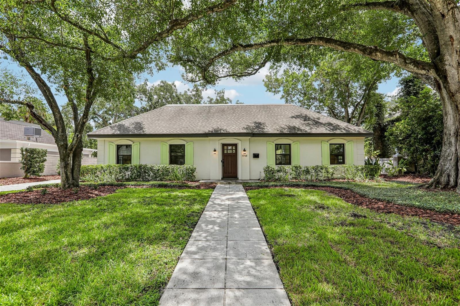 Welcome to this gorgeous renovated South Tampa home located in the quiet and highly desirable neighborhood of Culbreath Bayou. Thoughtfully updated with a functional floor plan, this residence offers 3 bedrooms, 2 full bathrooms, and a powder bath conveniently located off the office. The open-concept kitchen overlooks the spacious great room and eat-in dining area, creating an ideal layout for everyday living and entertaining. The light and airy kitchen features quartzite countertops, updated wood cabinetry, stainless steel appliances, generous island seating, and a charming built-in L-shaped banquette. A formal dining room provides additional flexibility and can easily be used as a dining space, living room, playroom, or other flex area. Renovated with today’s standards and finishes in mind, the home features French oak laminate flooring for a seamless flow throughout, along with updated bathrooms and classic millwork details including crown molding, chair molding, and the custom dinette booth. Additional improvements include Low-E impact glass replacement windows, a new AC system in 2024, and a new flat roof in 2025. The enormous attic offers stand-up room and exceptional storage or future possibilities. Located in one of South Tampa’s most convenient areas, this home is zoned for Mabry Elementary, Coleman Middle, and Plant High School. Enjoy quick access to Tampa International Airport, Hyde Park Village, Downtown Tampa, International Plaza, Midtown, and all that South Tampa has to offer.