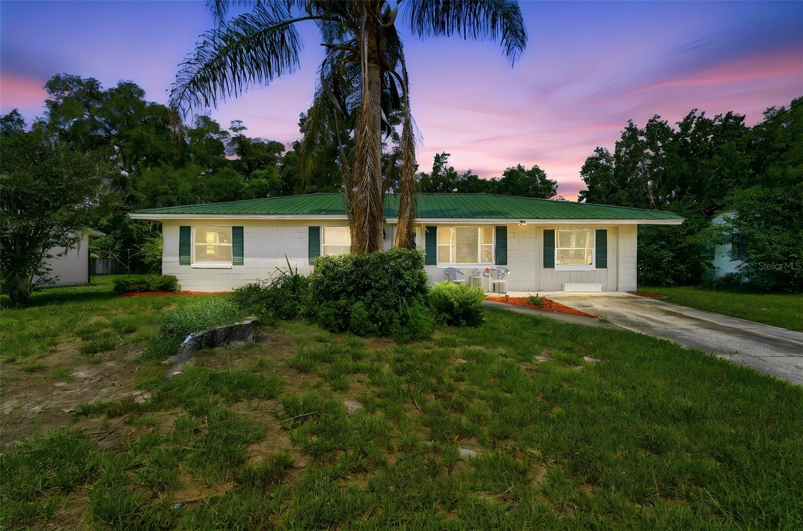 Welcome home to this charming 3-bedroom, 1.5-bath residence situated on a spacious .24-acre fenced lot, offering plenty of room for outdoor enjoyment, pets, and play. Inside, you'll find easy-to-maintain flooring throughout and a functional floor plan designed for comfortable everyday living.

The open eat-in kitchen features granite countertops, stainless steel appliances, and ample cabinet space, making it the perfect place to gather with family and friends. Two separate living areas provide flexibility for your lifestyle, with one space ideally suited for a home office, playroom, or additional family room.

The spacious bedrooms offer comfortable retreats, while the inside utility room provides extra storage space and added convenience. A durable metal roof adds peace of mind and long-term value.

Step outside to the oversized screened porch, an ideal spot to relax, entertain, or enjoy Florida's beautiful weather year-round. Storage Shed offers space to store you garden equipment. Conveniently located close to Downtown DeLand's charming shops, restaurants, and community events, this home combines comfort, functionality, and a fantastic location.

Don't miss this opportunity to own a move-in-ready home with space, versatility, and easy access to everything DeLand has to offer!