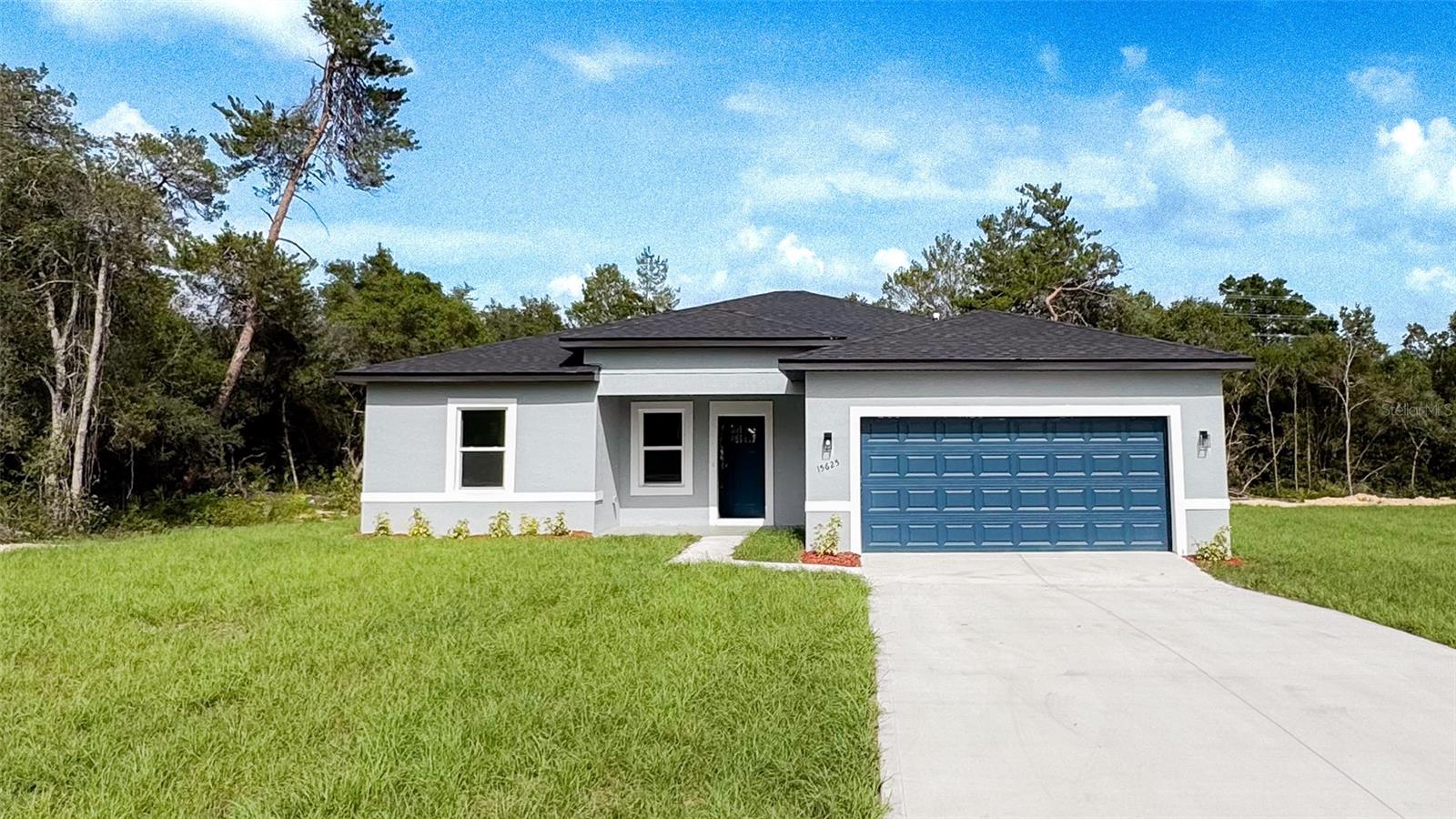 Welcome to your dream home in the heart of beautiful Ocala! This stunning ranch-style residence perfectly blends comfort, space, and timeless charm. Boasting four generously sized bedrooms, this home is ideal for families of all sizes. The primary suite features a spacious walk-in closet, while the additional bedrooms are equipped with built-in closets for effortless organization and convenience.

With three full bathrooms, morning routines and evening wind-downs will always be seamless. The expansive kitchen is a chef’s paradise, complete with rich solid wood cabinetry and elegant stone countertops that add a touch of sophistication and durability. Whether you're hosting a dinner party or preparing a quiet family meal, this kitchen is designed to impress.

Step into the spacious living room, where natural light pours in and creates a warm, welcoming atmosphere perfect for relaxing or entertaining. The classic ranch architectural style is accentuated by a charming front porch that invites you to enjoy the peaceful view of a beautifully maintained front garden, adding just the right touch of color and character to the home’s curb appeal.

A two-car attached garage provides secure parking and includes a garage door opener for ease and convenience.

Don't miss your opportunity to own this exceptional home in one of Ocala’s most desirable neighborhoods—schedule your showing today and prepare to fall in love!