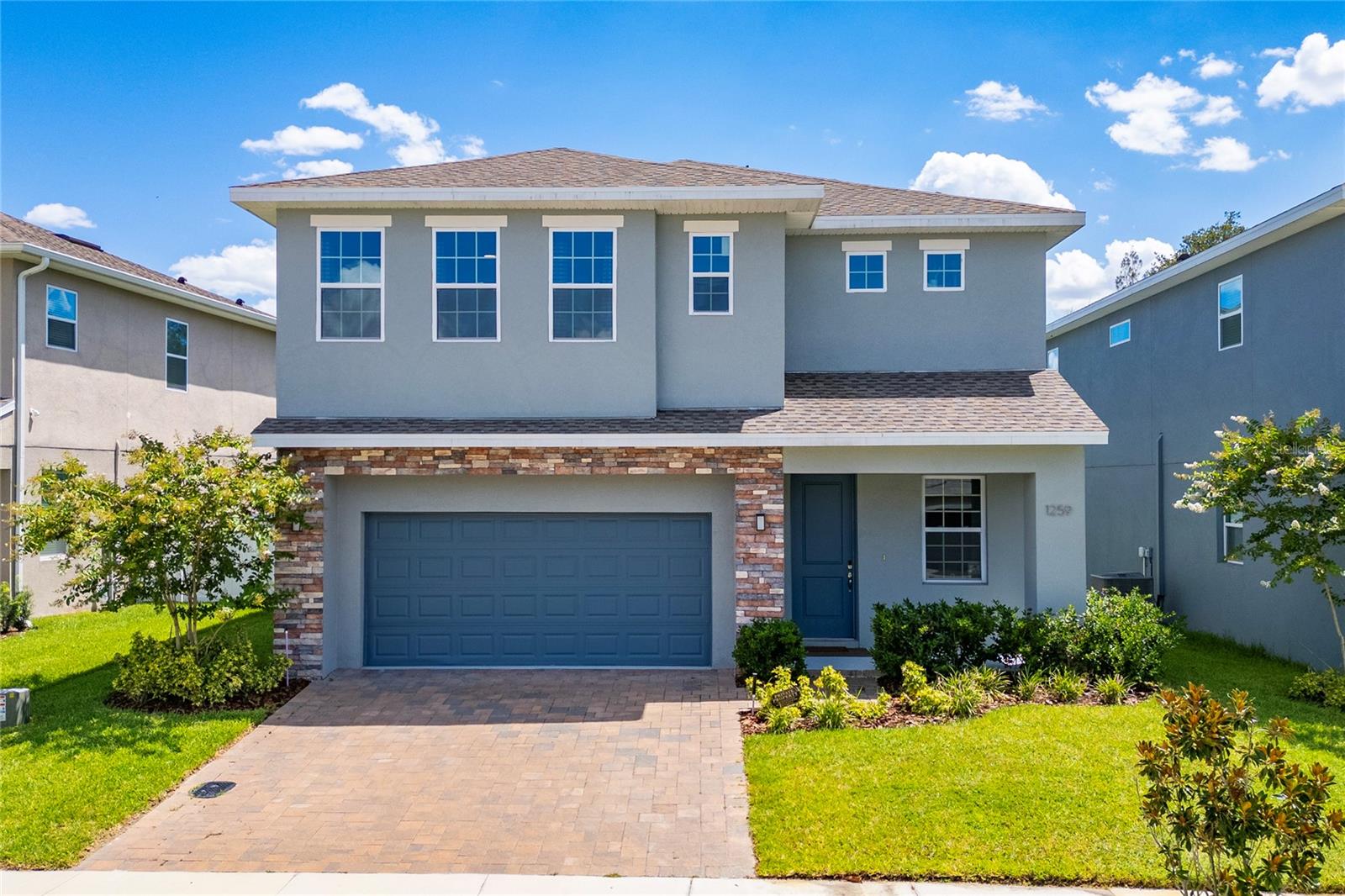 Welcome home to this highly sought-after Greenville Commons community in Casselberry.  Filled with natural light, the Charleston Floor Plan offers 2,687 heated square feet of spacious, open, and modern design. The tile flooring throughout all living spaces on the main level, along with the kitchen featuring quartz countertops, 42” upper cabinetry, and essential appliances such as a refrigerator, microwave, dishwasher, and range. It also includes a dual sink island and a stylish backsplash. The kitchen flows into the dining area and the family/gathering room, which has sliding doors leading to the covered lanai. All bedrooms are located on the second floor, including a regular suite and the owner's suite. The owner's suite boasts two spacious walk-in closets, a dual vanity, and a stand-up shower with a glass enclosure. The laundry room is conveniently situated on the second floor. The home also features a water softener system and reverse osmosis for the drinking water. The community is ideally located just across from The Geneva School and is within minutes of downtown Orlando, as well as major roads, highways, shopping centers, restaurants, and entertainment venues. Additionally, the community offers a playground, a dog park, and scenic pond views.