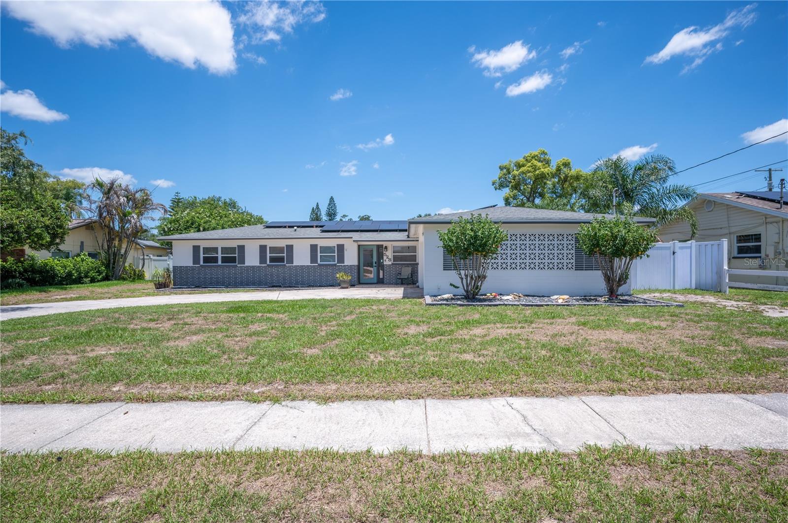 Welcome to this beautifully maintained 4-bedroom, 2-bathroom home in Brandon, Florida, offering the freedom of NO HOA and your own private backyard retreat. Enjoy year-round outdoor living with a saltwater pool that has been recently refinished and complemented by an updated pool cage. Inside, you’ll find tile flooring throughout the home for easy maintenance and a spacious great room that flows seamlessly into the kitchen. The kitchen offers abundant cabinet space and features appliances that are only about two years old. The primary suite includes a walk-in shower, while the hall bathroom has been updated with a new dual-sink vanity. Numerous improvements provide peace of mind, including new sliding glass doors, a new front door, and exterior paint completed approximately five years ago. Additional updates include new toilets installed within the last year, a new breaker box and wiring, and enhanced attic insulation and ventilation through spray foam installation. The home is also equipped with a HALO whole-home air purification system designed to help reduce airborne particles and improve indoor air quality, making it a wonderful feature for those with allergies or sensitivities. Energy-conscious buyers will appreciate the fully paid-off solar panels, providing added efficiency and long-term savings with no lease or financing to assume. The vinyl-fenced backyard offers privacy and plenty of space for entertaining, pets, or play. Whether relaxing by the pool or gathering with family and friends, this home is designed for comfortable Florida living. Conveniently located near shopping, dining, and major roadways, this move-in-ready property combines thoughtful updates with exceptional amenities. Don’t miss your opportunity to make this Brandon gem your next home!