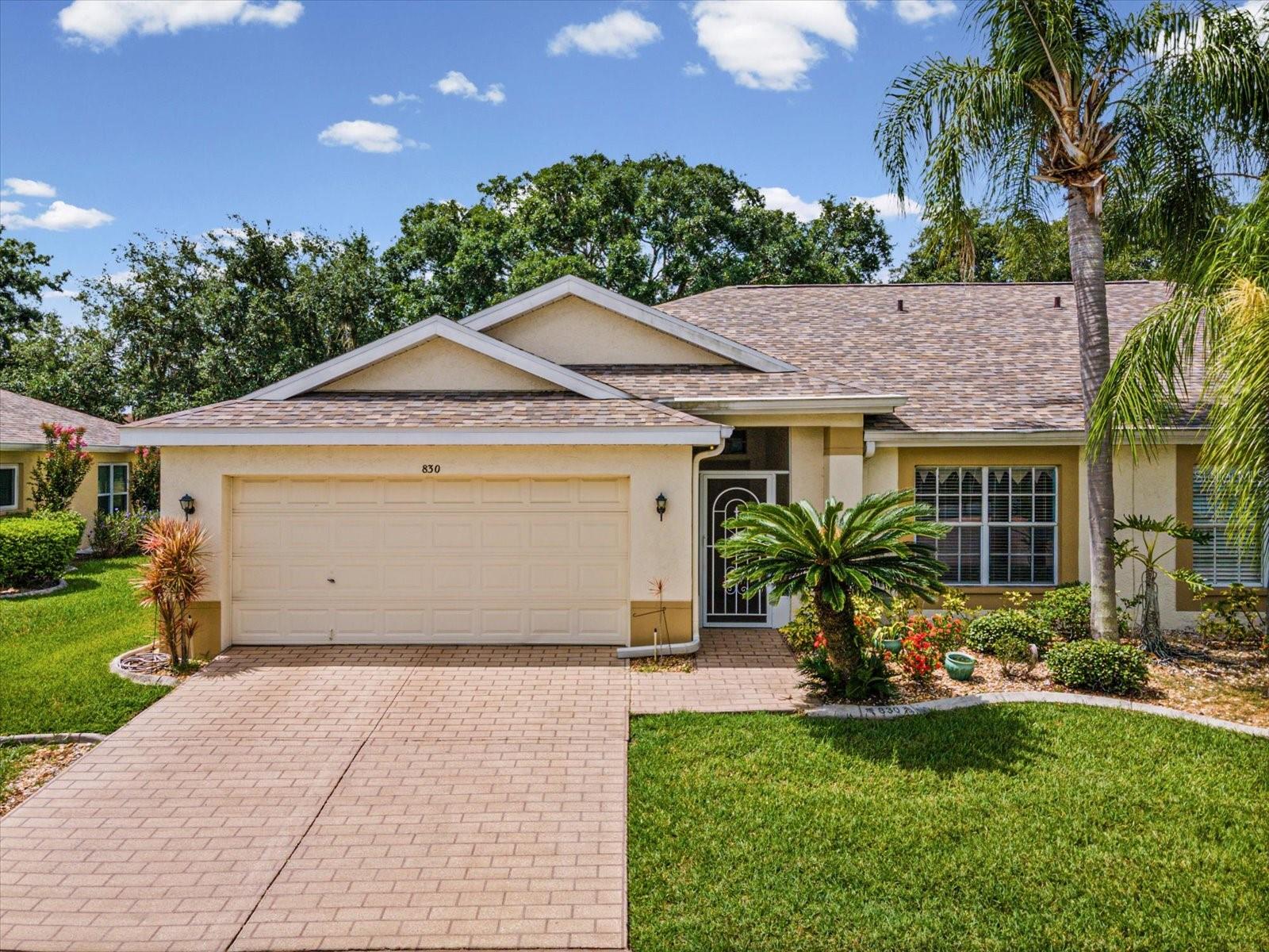 Enjoy the best of Florida's active adult lifestyle in this well-maintained 2-bedroom, 2-bath home located in the desirable 55+ gated community of Kings Point. Designed with a popular split-bedroom floor plan, this home offers privacy for both owners and guests, along with a spacious open living and dining area that's perfect for everyday living and entertaining. The kitchen features a breakfast bar, a sunny breakfast room, and plenty of cabinet and counter space. The enclosed Florida room, complete with portable heating and air conditioning, offers approximately 220 square feet of additional living space, making it the perfect spot for a home office, hobby room, reading nook, or entertaining guests year-round. A two-car garage provides ample space for parking and storage. Major updates include a new roof (2024), exterior paint (2026), hot water heater (2018), and HVAC (2016), providing added peace of mind. Kings Point residents enjoy resort-style living with access to multiple clubhouses, indoor and outdoor pools, fitness centers, tennis and pickleball courts, golf, on-site dining, countless clubs, classes, entertainment, and social activities. Golf cart accessibility makes it easy to reach shopping, restaurants, grocery stores, and medical facilities. Whether you're looking for a full-time residence or a seasonal retreat, this home offers comfort, convenience, and the opportunity to enjoy one of the Tampa Bay area's premier active adult communities.