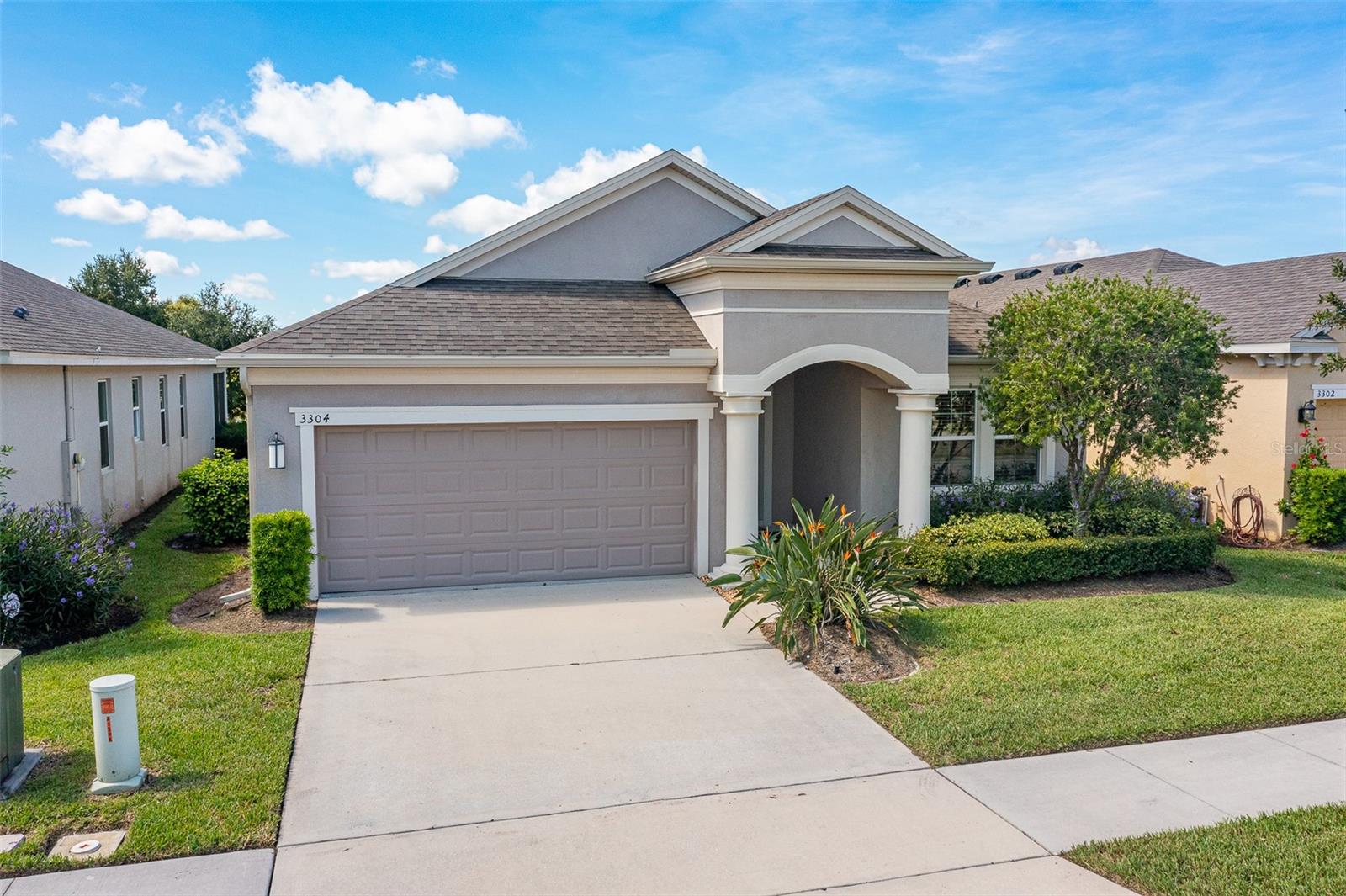 Welcome to 3304 Sagebrush St, Harmony, FL 34773—an exceptional former developer model home located in one of Central Florida’s premier golf and nature-focused communities. Perfectly situated on a waterfront pond with stunning golf course views, this 4-bedroom, 2-bath home offers 1,859 square feet of thoughtfully designed living space.

The interior showcases model-quality upgrades throughout, including a beautifully appointed kitchen featuring white 42” cabinets, quartz countertops, and an open layout ideal for entertaining. Natural light fills the home, creating a bright and inviting atmosphere.

Step outside to an impressive 10' x 40' lanai, perfect for relaxing or hosting while enjoying peaceful water and fairway views. Nestled in the highly desirable Harmony community, residents enjoy access to a top-rated golf course, scenic walking trails, and a lifestyle surrounded by nature—all within easy reach of Orlando.

A rare opportunity to own a standout home in a sought-after golf and nature community.
Residents of The Lakes at Harmony enjoy a private, resort-style clubhouse featuring a zero-entry pool, outdoor grill area, fireplace, fitness center, and multiple spaces for social gatherings and activities. The community offers an active lifestyle with amenities such as pickleball, tennis, and a wide variety of clubs and events. Homeowners also have access to two additional pools, miles of walking and hiking trails, an 18-hole Johnny Miller-designed golf course, and two natural lakes.

Set within the master-planned community of Harmony, spanning approximately 11,000 acres with extensive conservation areas, The Lakes offers a peaceful setting surrounded by natural beauty, including frequent wildlife sightings and stunning sunsets. Conveniently located about 30 minutes from Orlando International Airport and within easy reach of Orlando attractions and the beaches. The CDD bond/debt portion has been paid in full, with only the O&M portion remaining. Buyer to verify all room dimensions, square footage, and HOA restrictions.