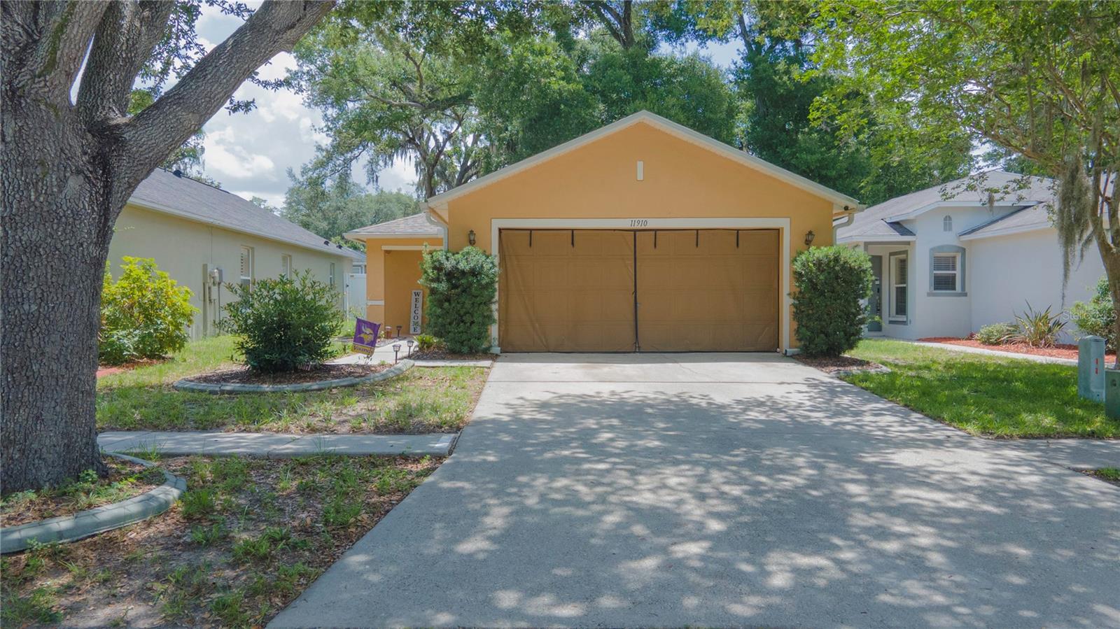 Welcome to this beautifully updated home in the desirable Mango Groves community! This charming 2-bedroom, 2-bath split-floorplan home offers comfort, style, and major upgrades including a 2021 roof, 2023 A/C, fully paid-off solar panels installed in 2022, updated bathrooms, refinished kitchen cabinets, and newer flooring throughout the kitchen, living room, and hallway. The bright kitchen features stainless steel, a convection oven, eat-in dining area, and views of the screened and covered lanai — perfect for relaxing year-round. The private primary suite offers newer flooring, a spacious walk-in closet, and a beautifully en-suite bathroom. Additional, highlights include an interior laundry room, whole-home water filtration system, sealed gutters, and a re-designed fully fenced backyard with vinyl privacy fencing and a Florida-friendly butterfly garden. Enjoy low HOA fees and NO CDD while being conveniently located near shopping, dining, I-4, I-75, downtown Tampa, Busch Gardens Tampa Bay, and MacDill Air Force Base. This move-in ready home is the perfect blend of upgrades, location, and Florida living!