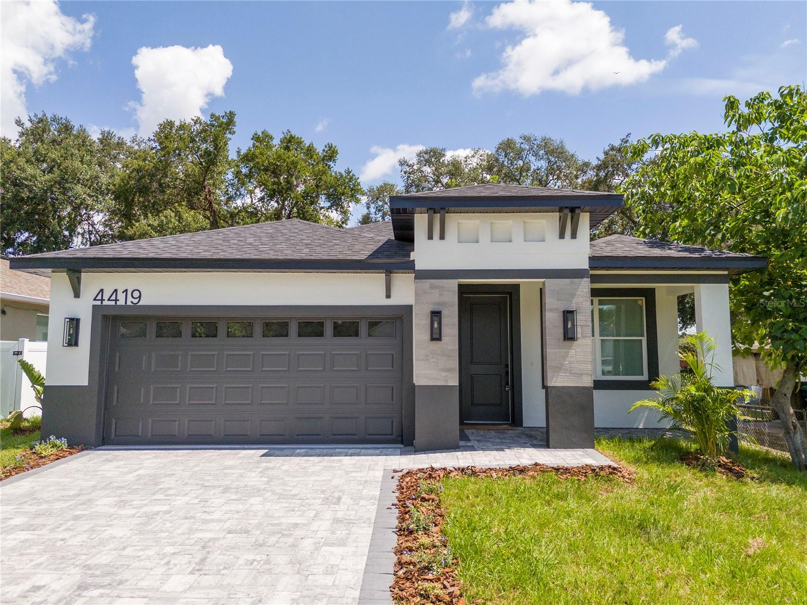 Virtually Staged. Welcome to 4419 College Drive, Orlando, FL 32811, a thoughtfully designed new construction home offering the perfect combination of modern comfort, functional living spaces, and an excellent Central Orlando location. Featuring 4 bedrooms, 2 full bathrooms and one half bathroom, and an attached 2-car garage, this residence is ideal for families, first-time buyers, or investors seeking a spacious and versatile home.

Designed with an open-concept layout, the heart of the home seamlessly connects the family room, dining area, and kitchen, creating an inviting space for everyday living and entertaining. The kitchen features a breakfast bar with seating possibility, abundant cabinetry, and a layout that allows you to stay connected with family and guests while preparing meals.

The private primary suite is tucked away for added privacy and includes a spacious walk-in closet and an en-suite bathroom with dual vanities and a large walk-in shower. Three additional bedrooms provide flexibility for family members, guests, or a home office. Two additional full bathrooms—including a convenient hall bath—offer comfort and convenience for both residents and visitors.

Additional highlights include a dedicated laundry room, a separate mechanical/AC room for accessibility, generous closet space throughout, and a 2-car attached garage. Enjoy Florida living year-round with both a covered front porch and a rear porch, perfect for relaxing outdoors or entertaining.

Conveniently located near major highways, shopping, dining, schools, downtown Orlando, the Mall at Millenia, Universal Orlando Resort, and other world-famous attractions, this home offers easy access to everything Central Florida has to offer.

Don't miss this exceptional opportunity to own a beautifully designed new home in a growing Orlando location—schedule your private showing today!
