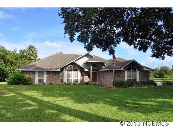 Unique opportunity to buy a home with elbow room so close to town! Featuring vaulted ceilings & large rooms. Gas fireplace in family room. Formal dining room + eat-in kitchen. Roof replaced 2004. Generator. Florida room, small patio, shuffleboard court & lakefrontage. Interior laundry room. Property goes to other side of lake. Some storm shutters stored in attic. ;Water: City