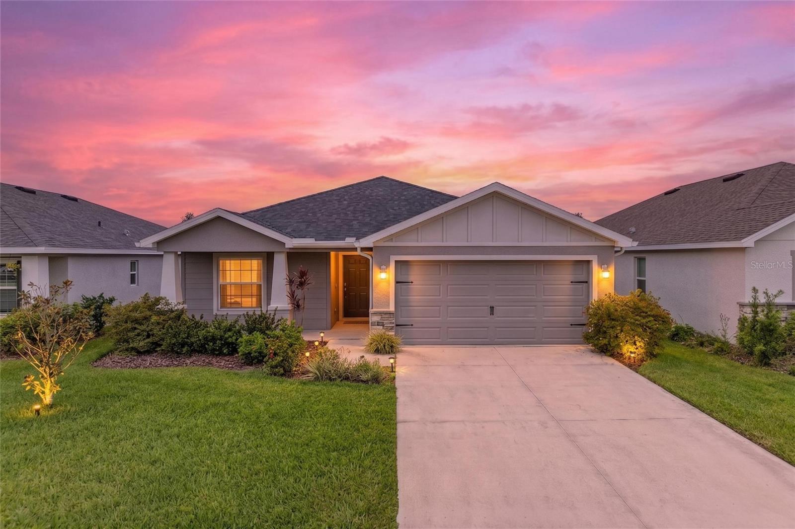 BETTER THAN NEW! Step into this stunning, model-perfect home that looks like it came straight from the pages of a designer magazine! Built in 2022 with over $13,000 in upgrades, this exceptional home is move-in ready and designed to impress. This property qualifies for a 1% LENDER INCENTIVE when using the preferred lender. Located in the highly sought-after Aviary at Rutland Ranch, this home features gorgeous luxury vinyl flooring throughout (no carpet!), creating a seamless, modern look from room to room. The bright, open-concept layout was designed for both everyday living and effortless entertaining. At the heart of the home is a chef-inspired kitchen featuring stainless steel appliances, modern cabinetry, a large center island accented with stylish new pendant lighting, and an effortless flow into the dining and living areas. The spacious primary suite offers a relaxing retreat with a walk-in closet and spa-inspired bath, while three additional bedrooms provide plenty of space for family, guests, or a home office. Guests will appreciate the beautifully upgraded bathroom featuring a sleek glass shower door, adding a touch of modern elegance. Step outside to your screened-in lanai—the perfect place to enjoy peaceful mornings with coffee or unwind after a long day. Thoughtful upgrades such as custom-installed gutters, an upgraded ceiling fan, and enhanced garage lighting further elevate this home's comfort, functionality, and value. Residents of Aviary at Rutland Ranch enjoy resort-style amenities, including a heated community pool, playground, pickleball and basketball courts, and scenic walking trails. Conveniently located just minutes from top-rated schools, shopping, and dining, this home offers the perfect balance of tranquility and everyday convenience. Why wait months for new construction when you can move right into this fully upgraded, better-than-new home? Every detail has already been completed, allowing you to simply unpack and start enjoying the Florida lifestyle. Schedule your private showing today!