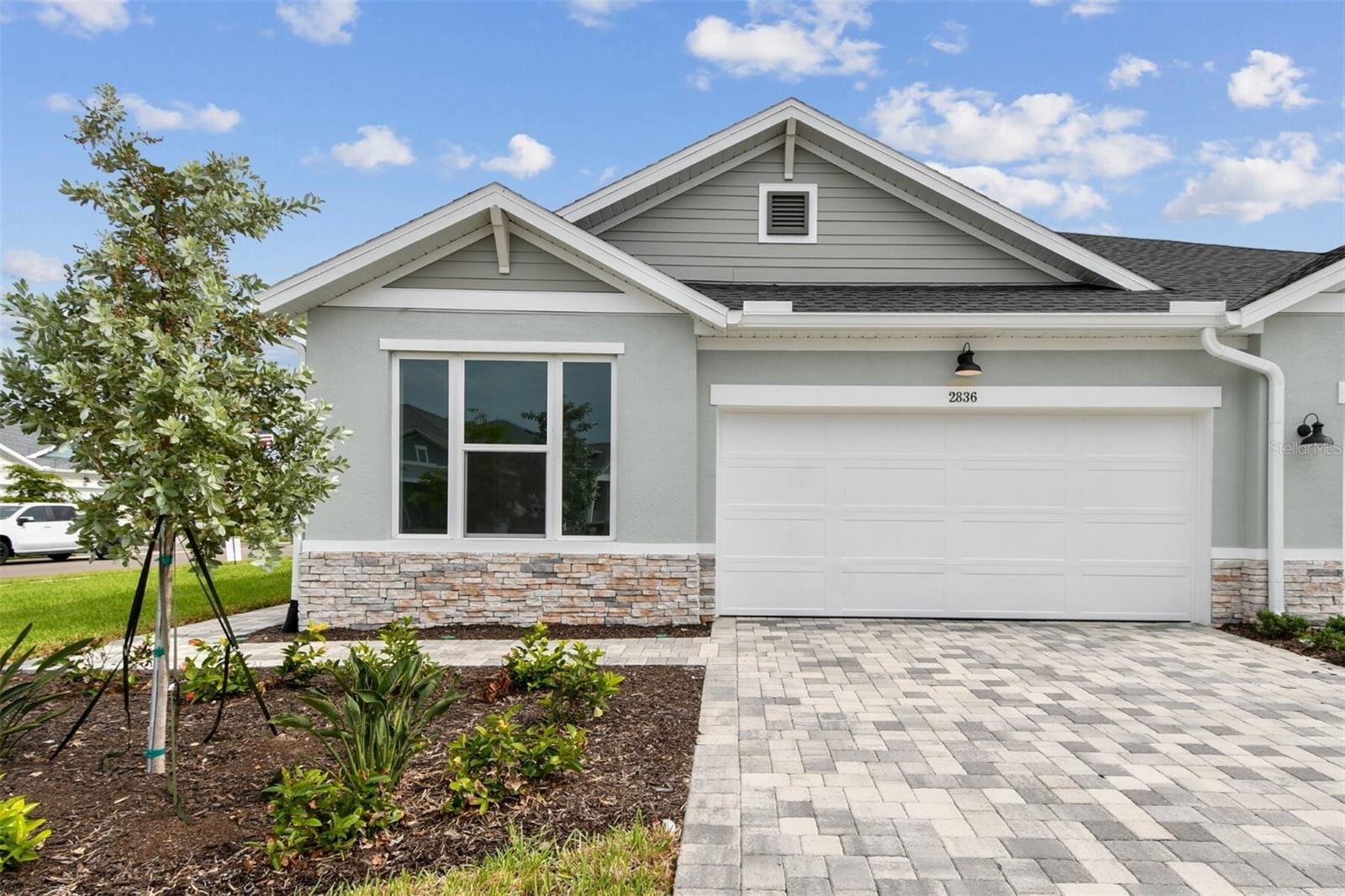 Move in ready. Built by David Weekley Homes, the Fieldview is a stunning example of craftsmanship and thoughtful design in a sought-after community near Sarasota’s vibrant downtown and beautiful beaches .This 3-bedroom, 2-bathroom layout includes a 2-car garage is situated on a beautiful corner lot close to future amenities. The spacious owner’s suite serves as a private haven, while the heart of the home flows effortlessly into a large lanai, where you can relax and take in breathtaking pond views . A corner pantry, center island and open sight lines contribute to the culinary layout of the contemporary kitchen.
Guest rooms are privately situated away from the home’s living spaces and rests next to a full bathroom all its own.  Enjoy a low-maintenance lifestyle with included lawn care, while hurricane impact windows provide peace of mind and enhanced protection, ensuring both elegance and security in your dream home. **This property offers a limited-time interest rate incentive.