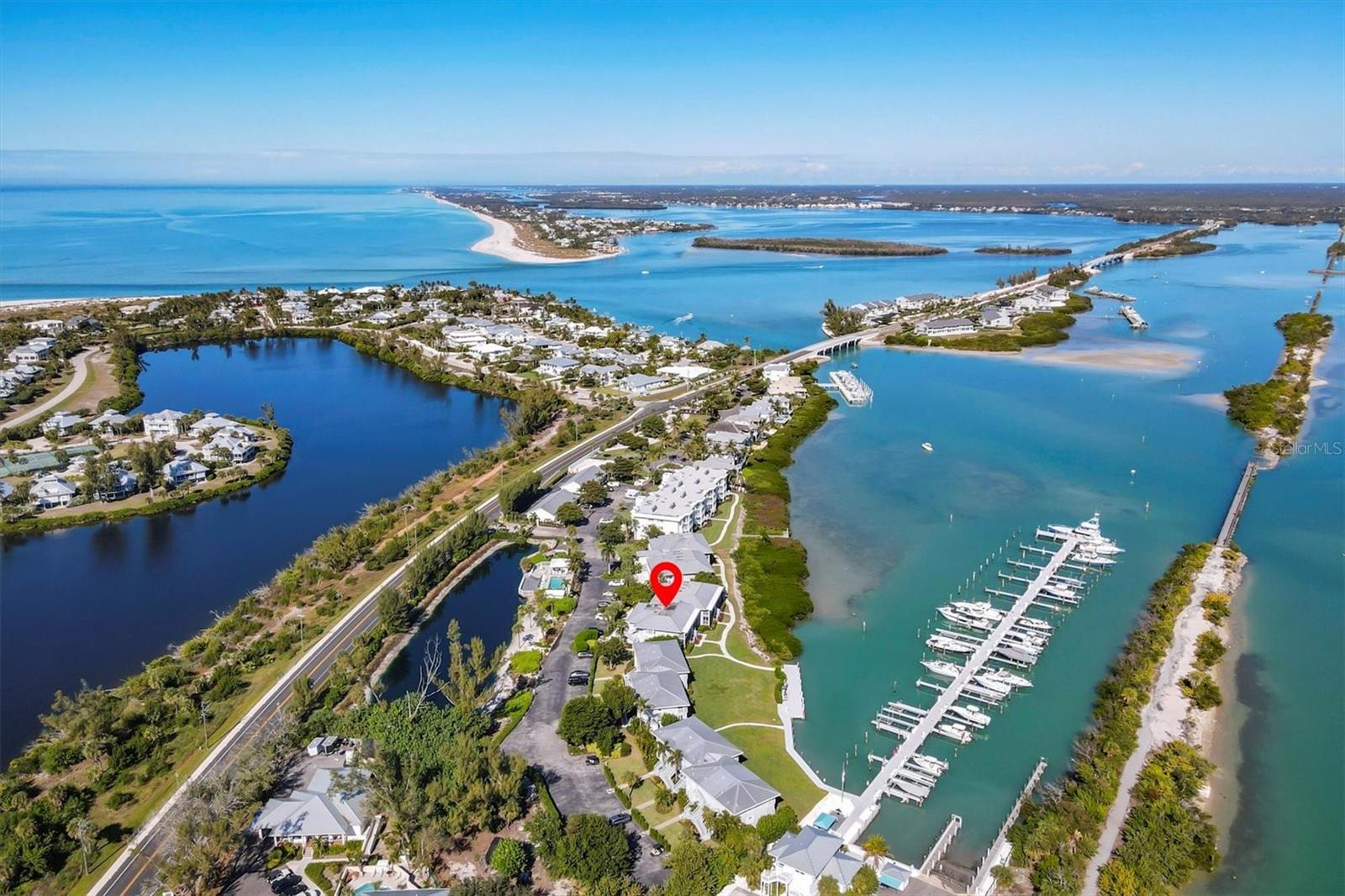 Beautifully renovated and offered turnkey furnished, this coastal inspired two bedroom, two bath residence is ideally positioned on the coveted second floor within Marina Village at the Boca Grande Club. Encompassing 1,065 square feet, the condo is thoughtfully designed and drenched in soothing coastal hues and curated décor, creating a relaxed yet refined island retreat.
The open living areas feature ceramic tile flooring with a warm wood appearance, perfectly complementing the home’s breezy beach aesthetic. The updated kitchen is equipped with new appliances less than two years old and a brand-new washer and dryer, offering effortless everyday living.
Both bathrooms have been tastefully remodeled. The primary bath showcases beautifully selected tile, a dual rain-head shower, and a frameless glass enclosure, while the guest bath features a stylish tiled shower with a rain-head and frameless glass. Beadboard detailing in the bathrooms and dining area adds timeless coastal charm, while the dining space is further enhanced by a custom built-in bench with integrated storage, a bespoke and highly functional design element.
The home is further enhanced with impact-rated windows and sliding glass doors, plantation shutters, and custom-designed closet systems in both bedrooms, offering exceptional functionality without sacrificing style. The residence backs directly to the marina, where large impact sliders frame stunning water views and open to capture refreshing waterfront breezes.
Enjoy spectacular marina views from the sunroom, an ideal spot for morning coffee or evening cocktails, where boats glide by and dolphins and manatees are frequent visitors. A separate, locked storage area provides ample space for bikes, beach gear, and more.
Just steps from the sparkling community heated pool, Marina Village owners enjoy exclusive membership to the Boca Grande Club, a private, gated enclave offering resort-caliber amenities. Indulge in three resort-style swimming pools, a serene hot tub, Gulf-front dining and tiki bar, eight Har-Tru tennis courts, a state-of-the-art fitness center, and direct access to Boca Grande’s wide, pristine beaches.
A rare opportunity to own a move-in-ready waterfront condo in one of Boca Grande’s most sought-after communities, where thoughtful craftsmanship meets the ultimate coastal lifestyle.